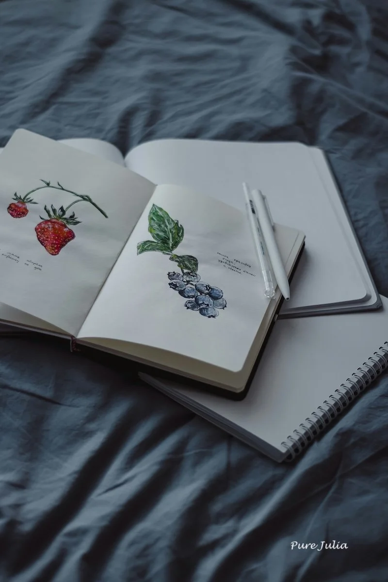 Notebooks with creative drawings.