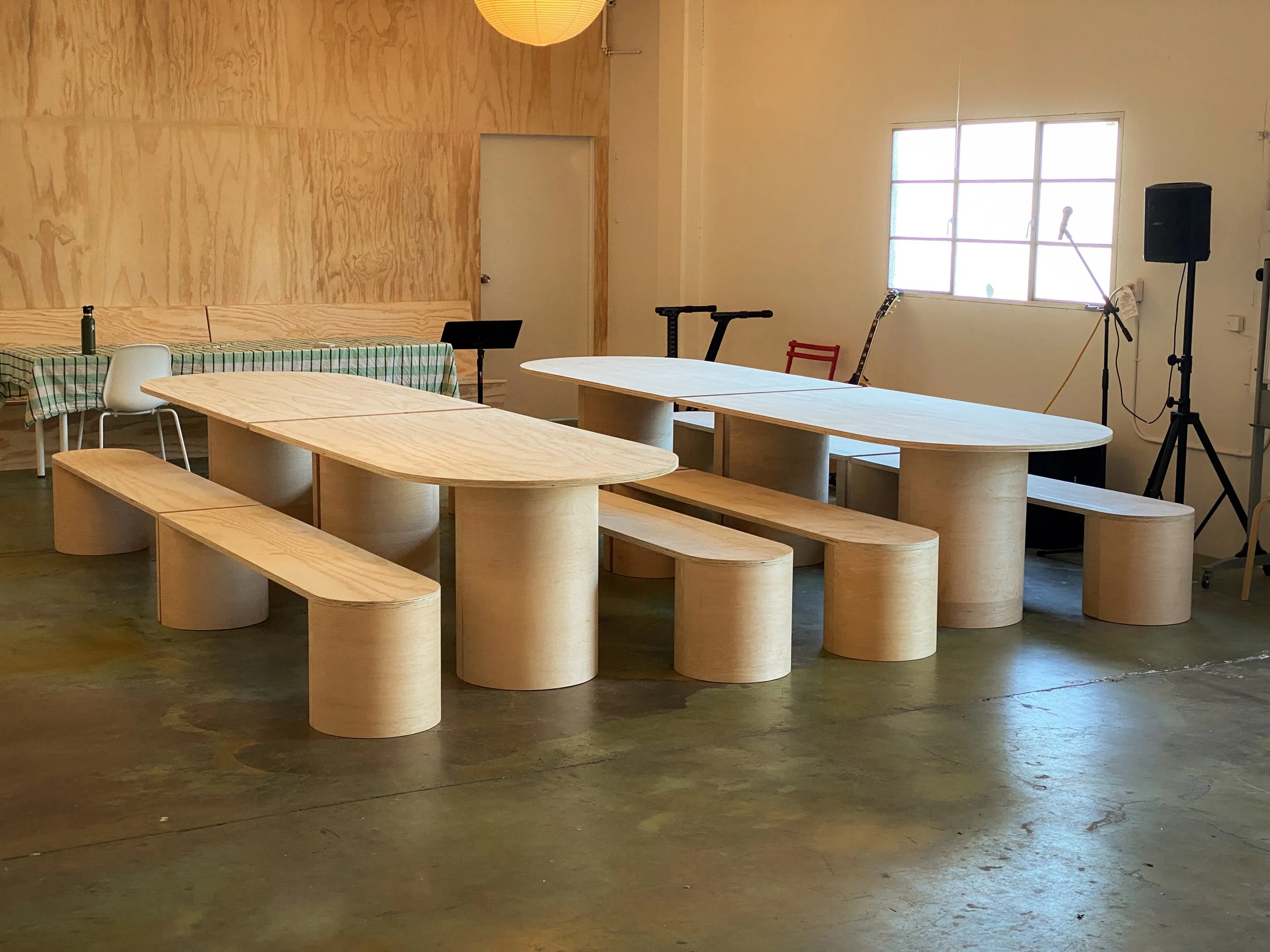 Simple and modern Plywood tables and benches for multi-purpose use.