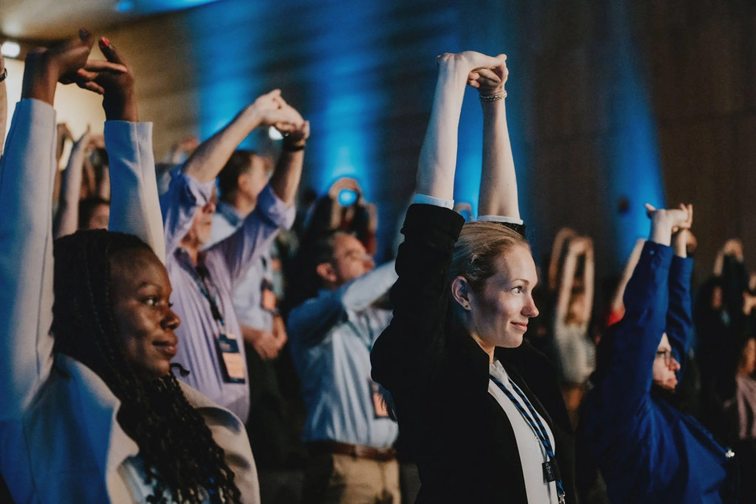People doing exercise at an event