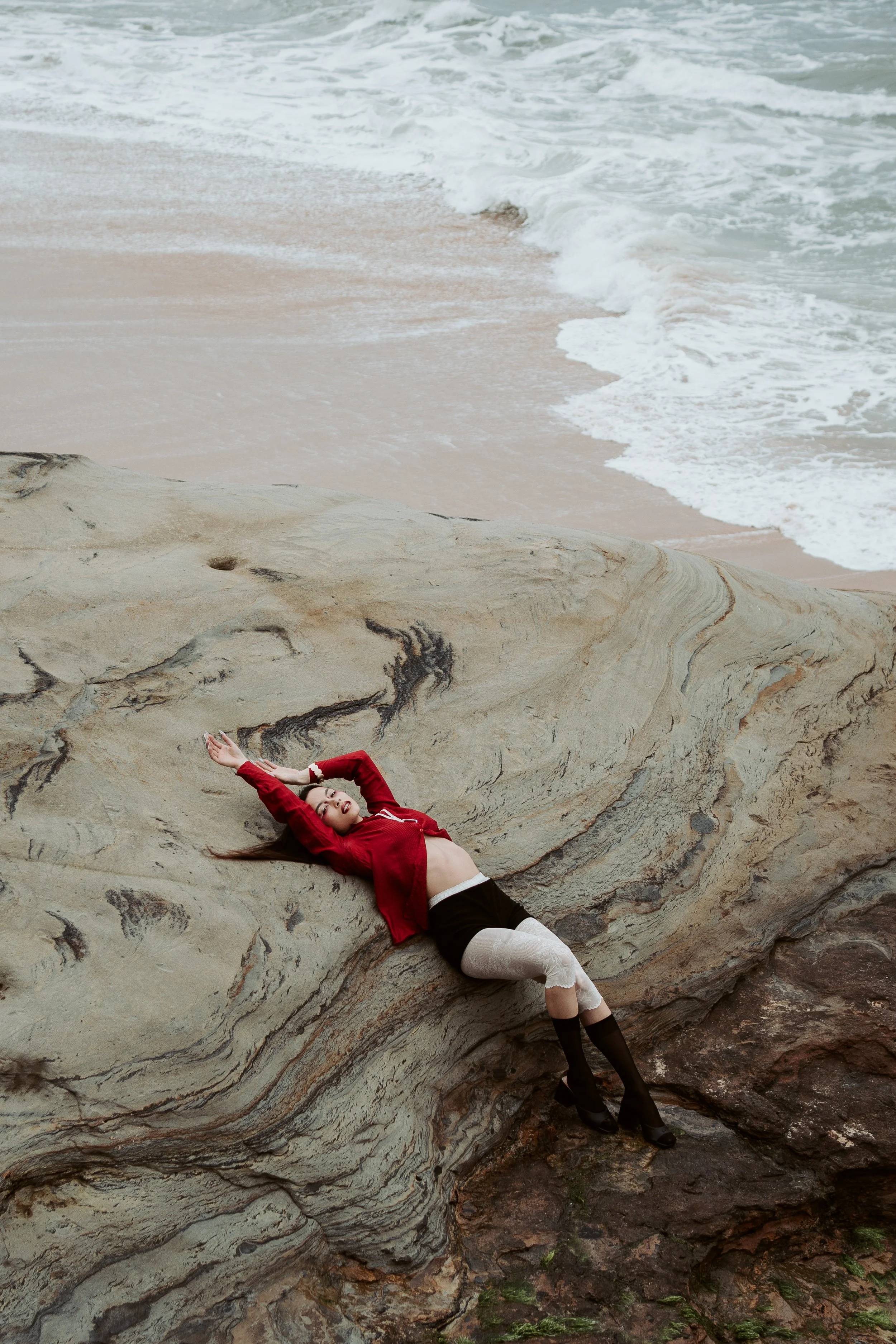 Artistic fashion portrait focused on form, texture, and sensual expression in an elegant and confident way.