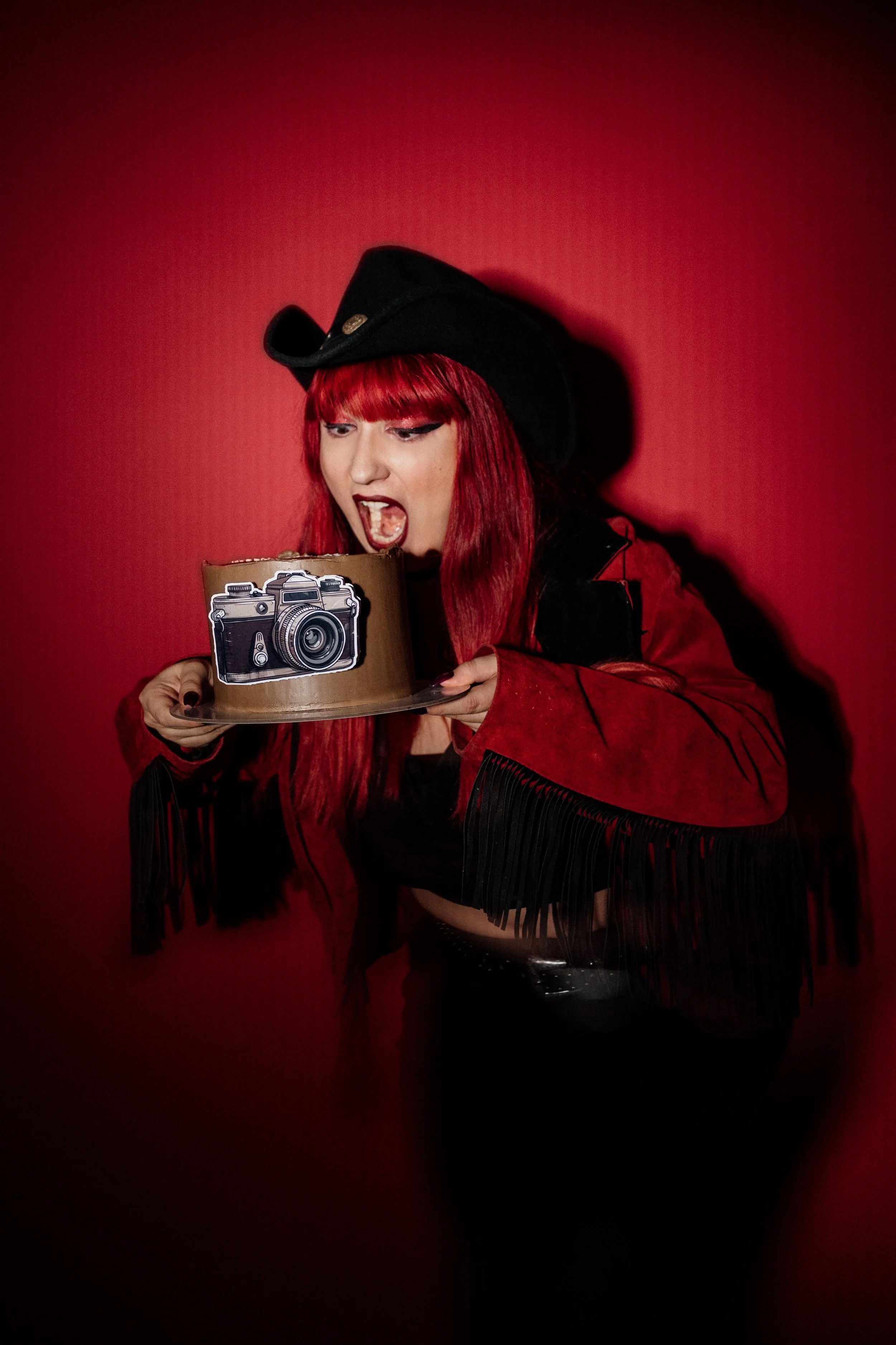 Portrait of a model eating cake in the photo studio