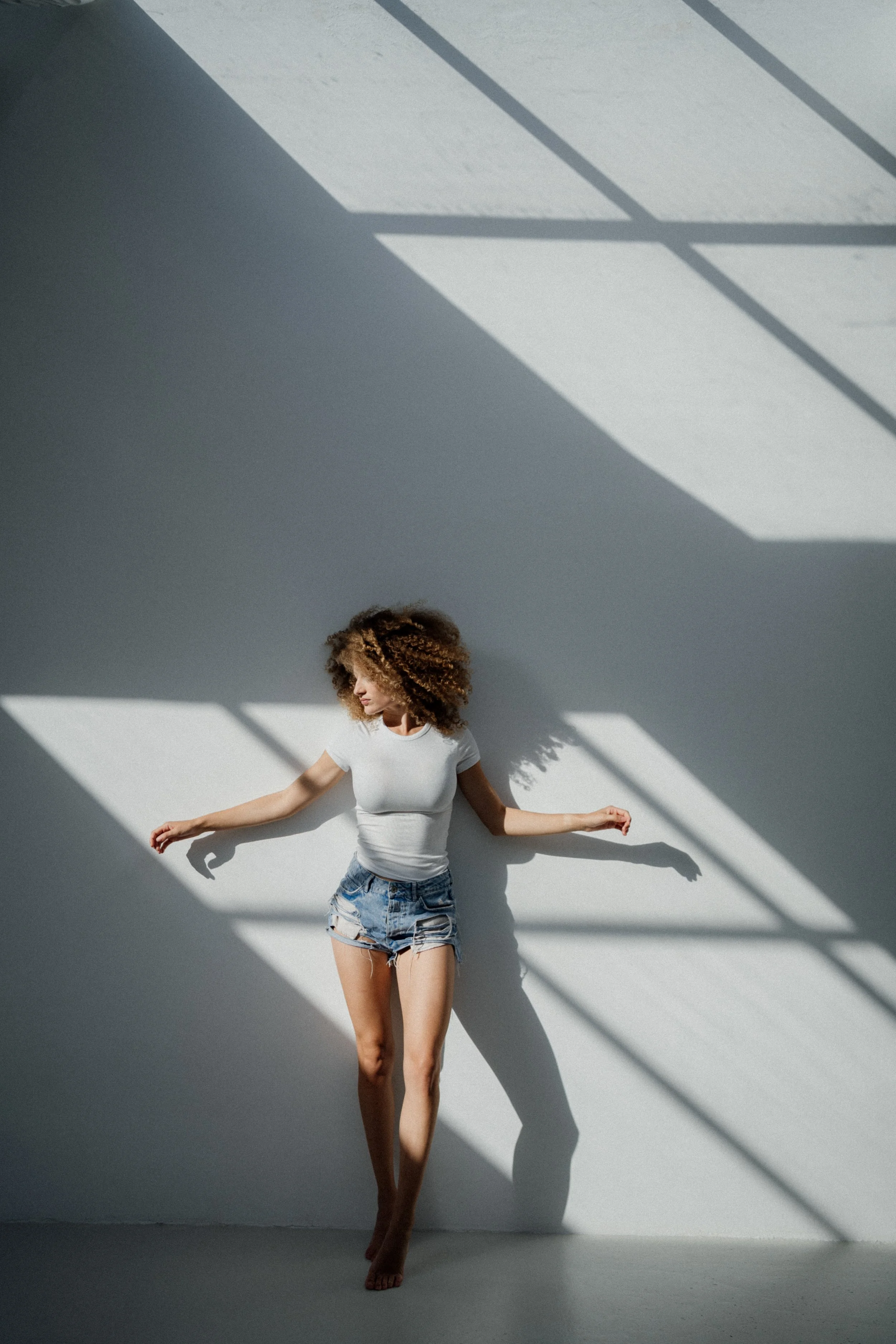 Model photographed on a studio with bold light