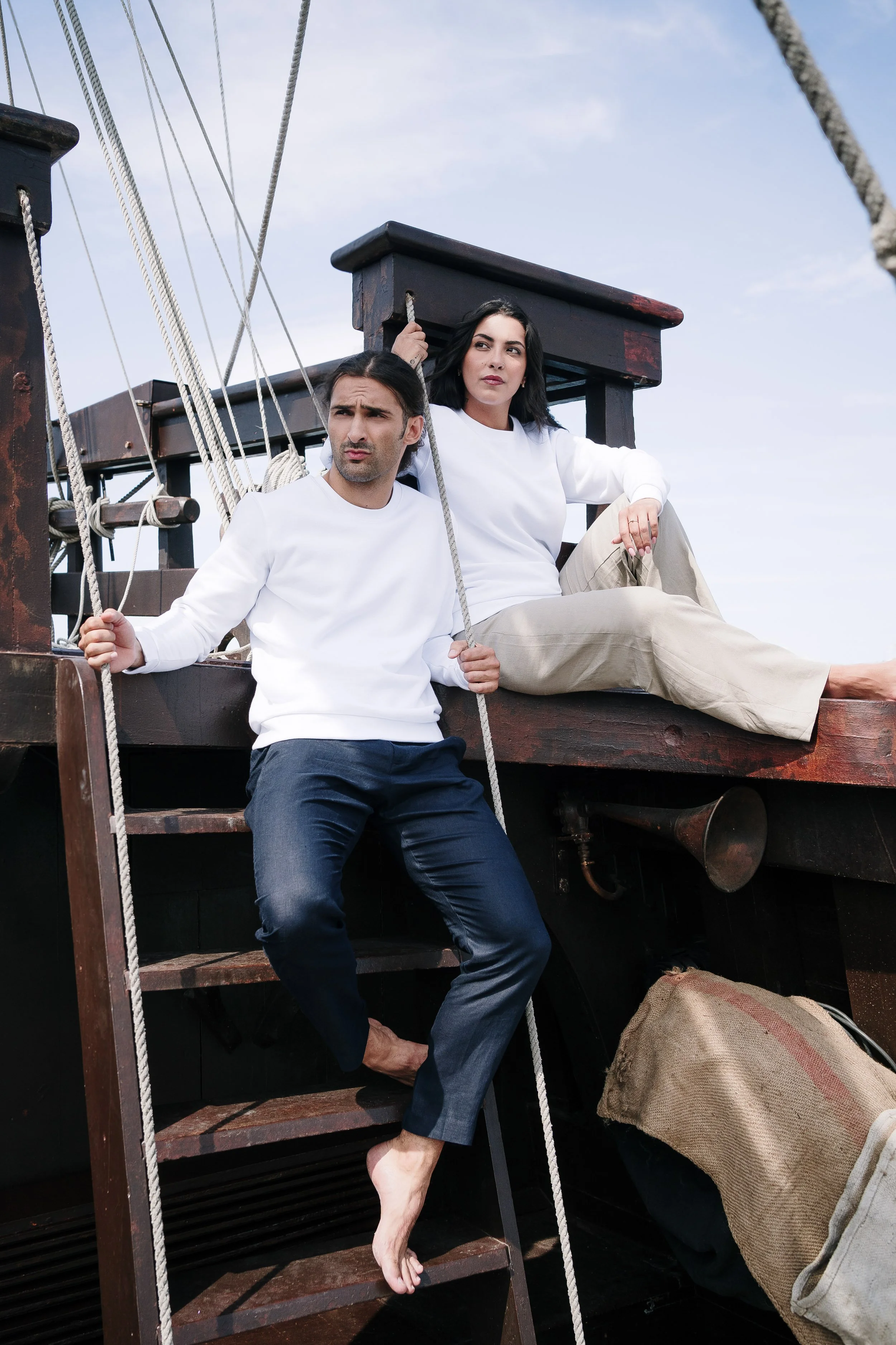 Models posing in a boat