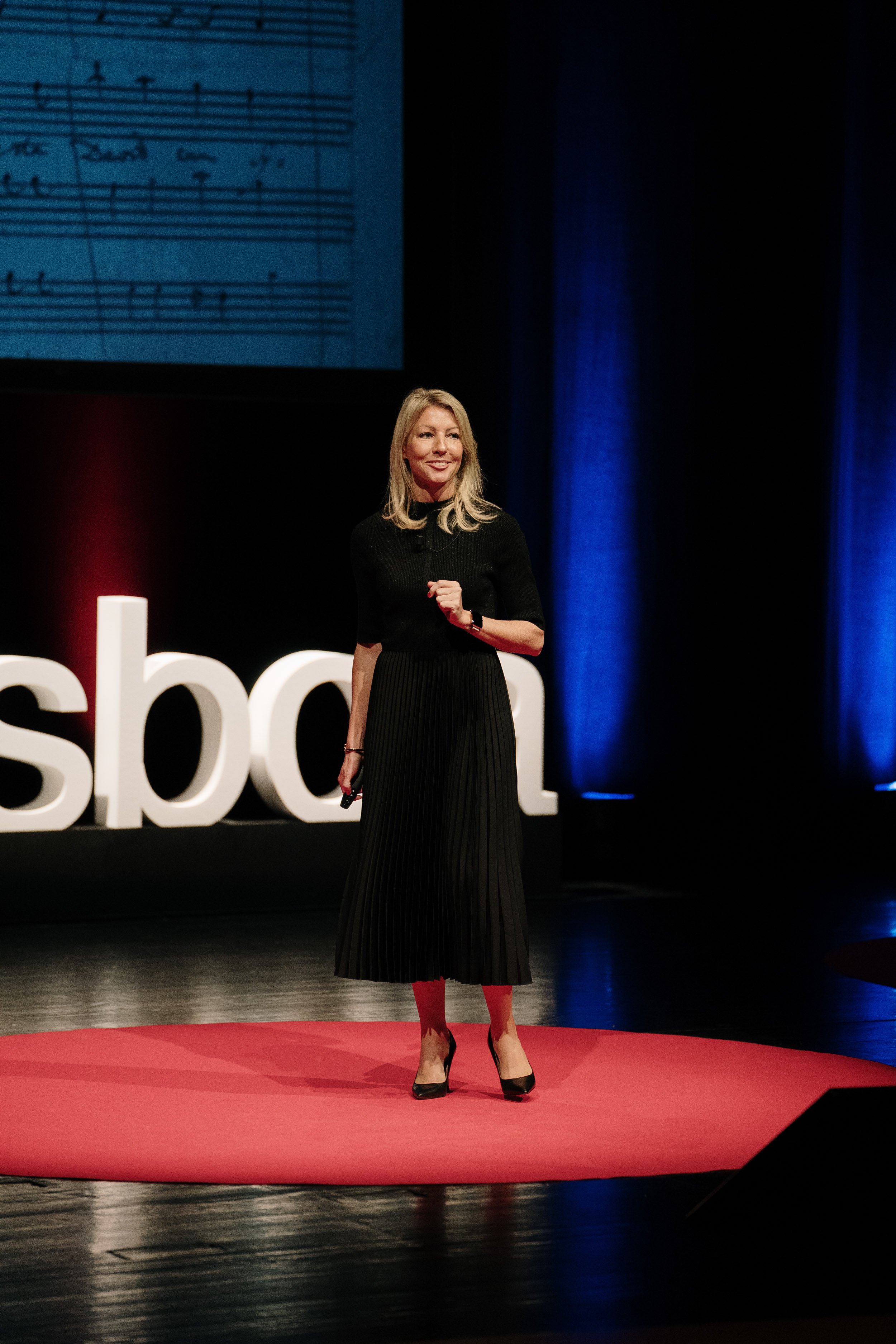 Speaker smiling at panel