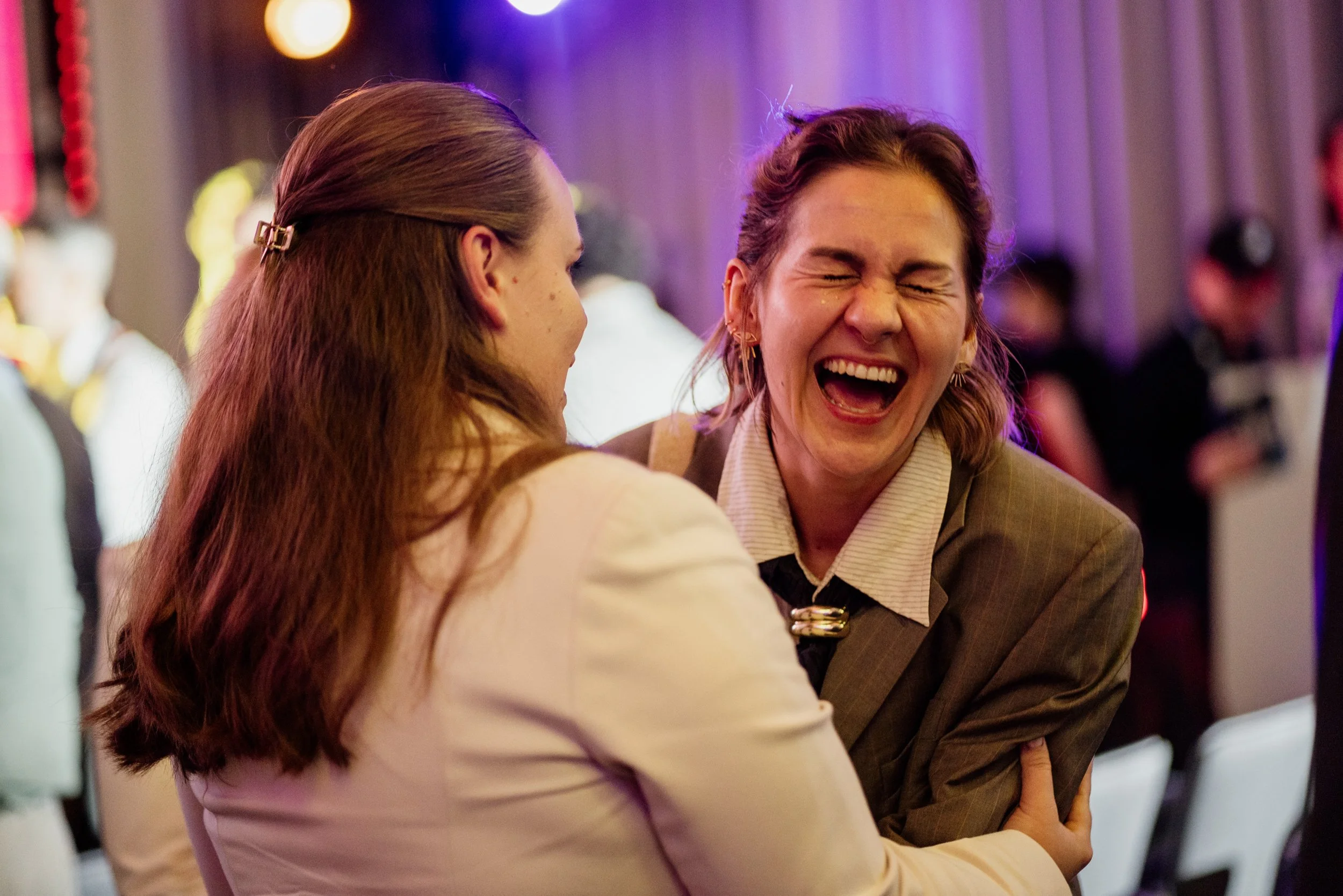 Candid interactions between people at event