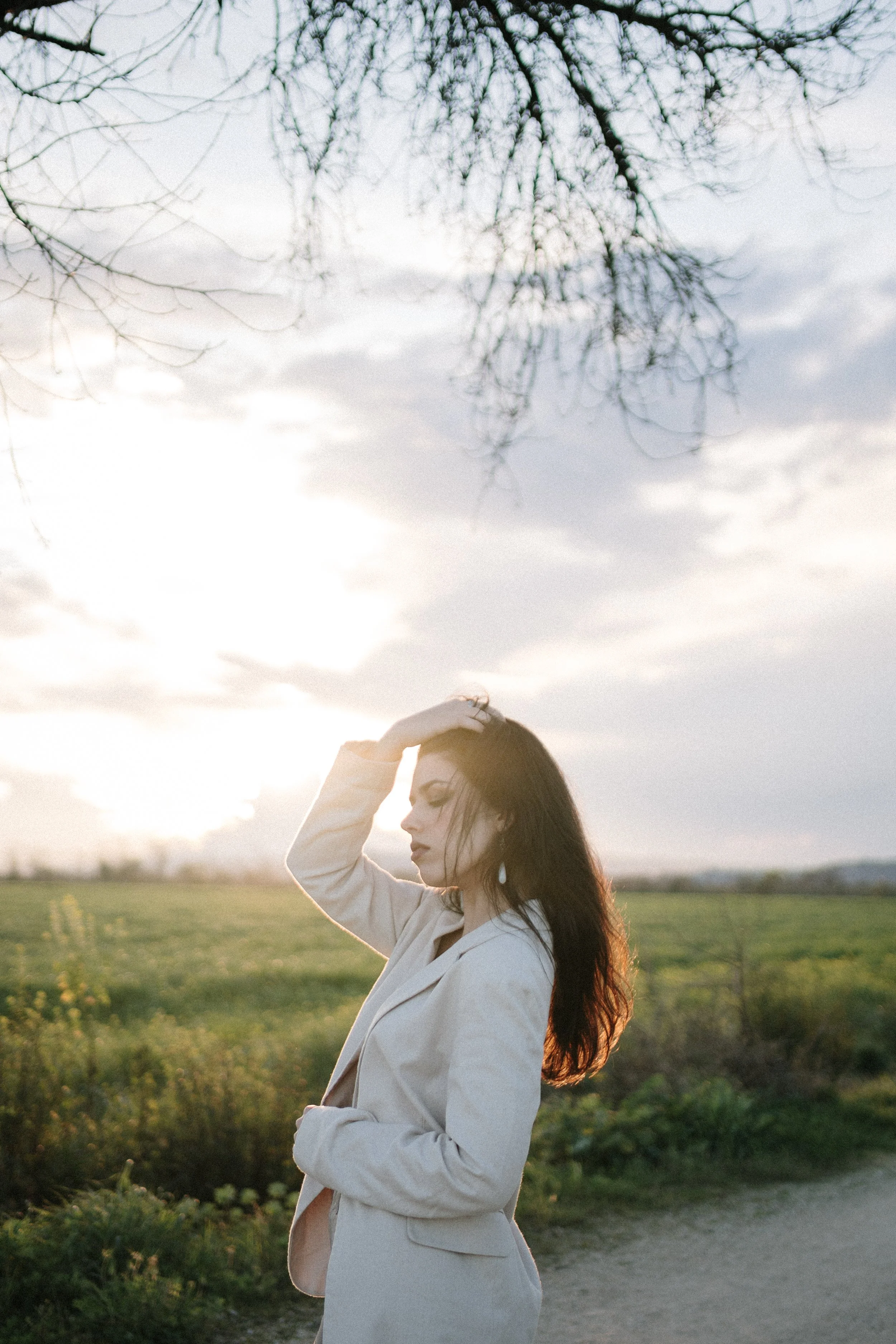 Editorial female portrait focused on expression and emotion, photographed in an intimate and artistic style.
