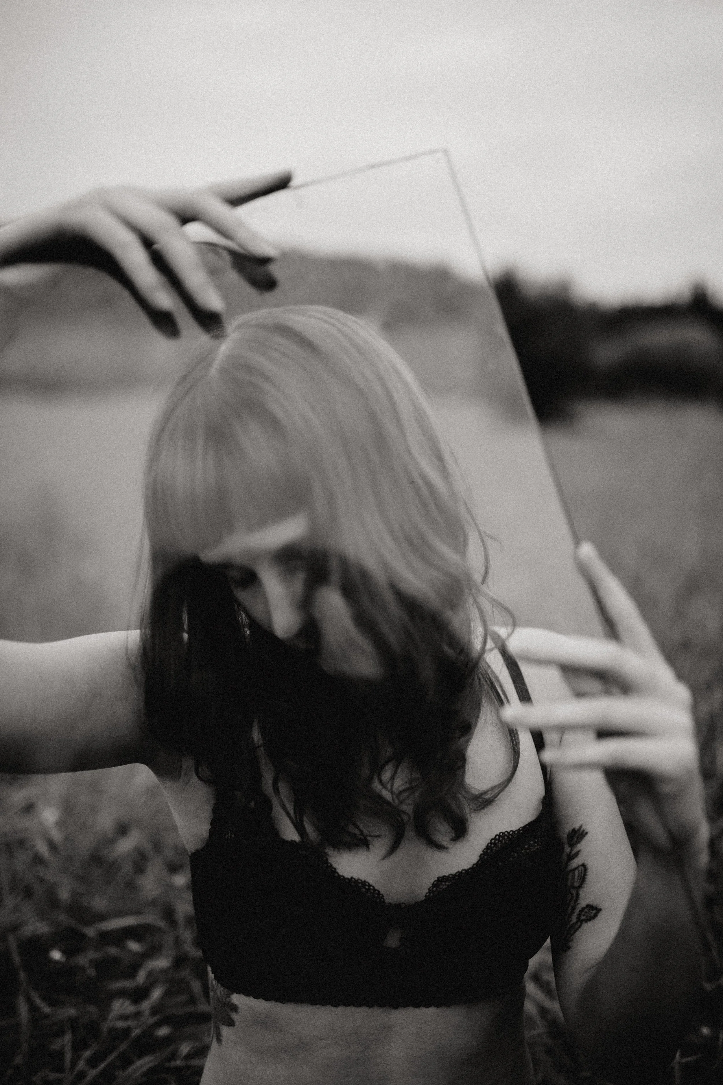 Model with glass in black and white
