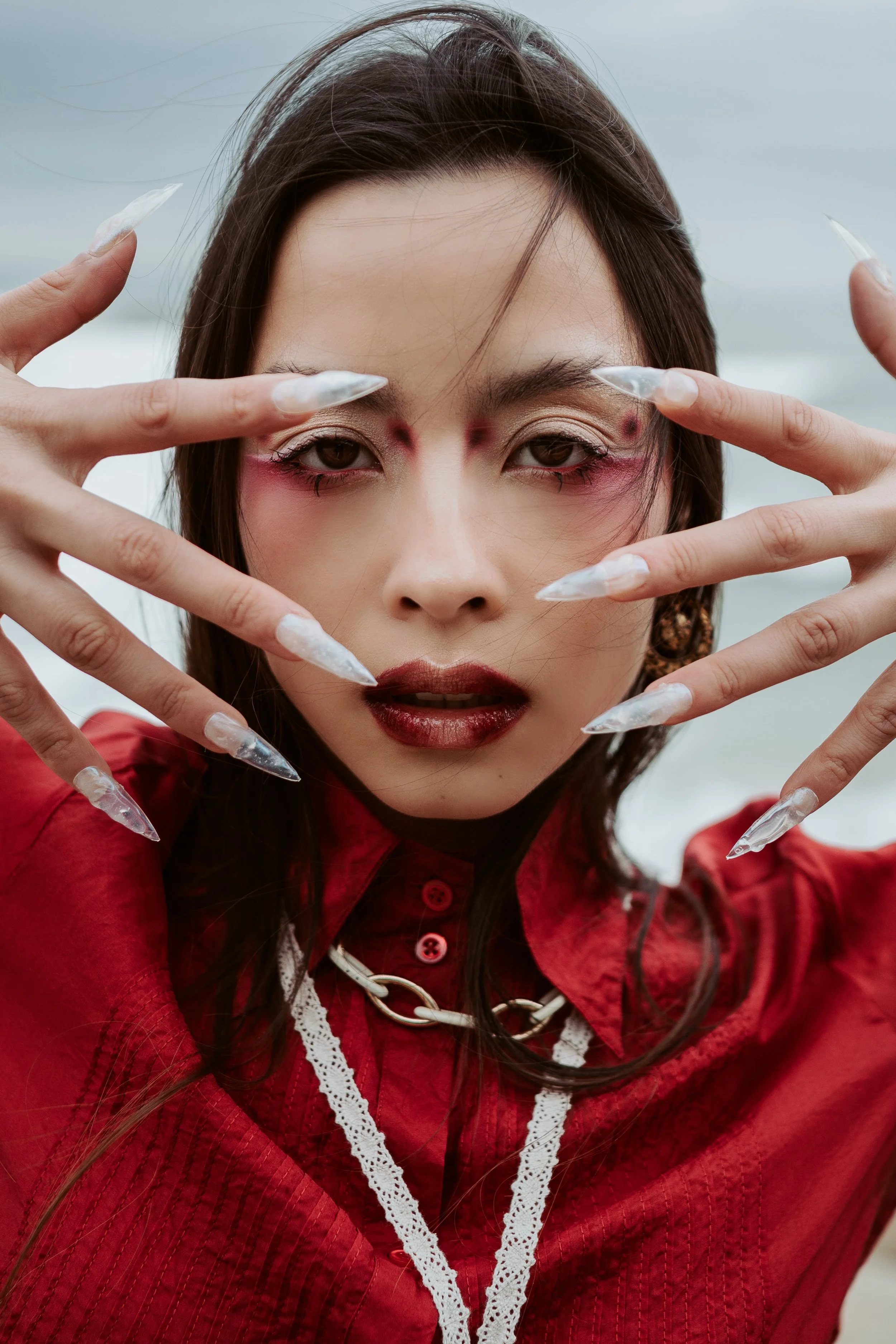 Conceptual fashion portrait with bold styling and expressive pose