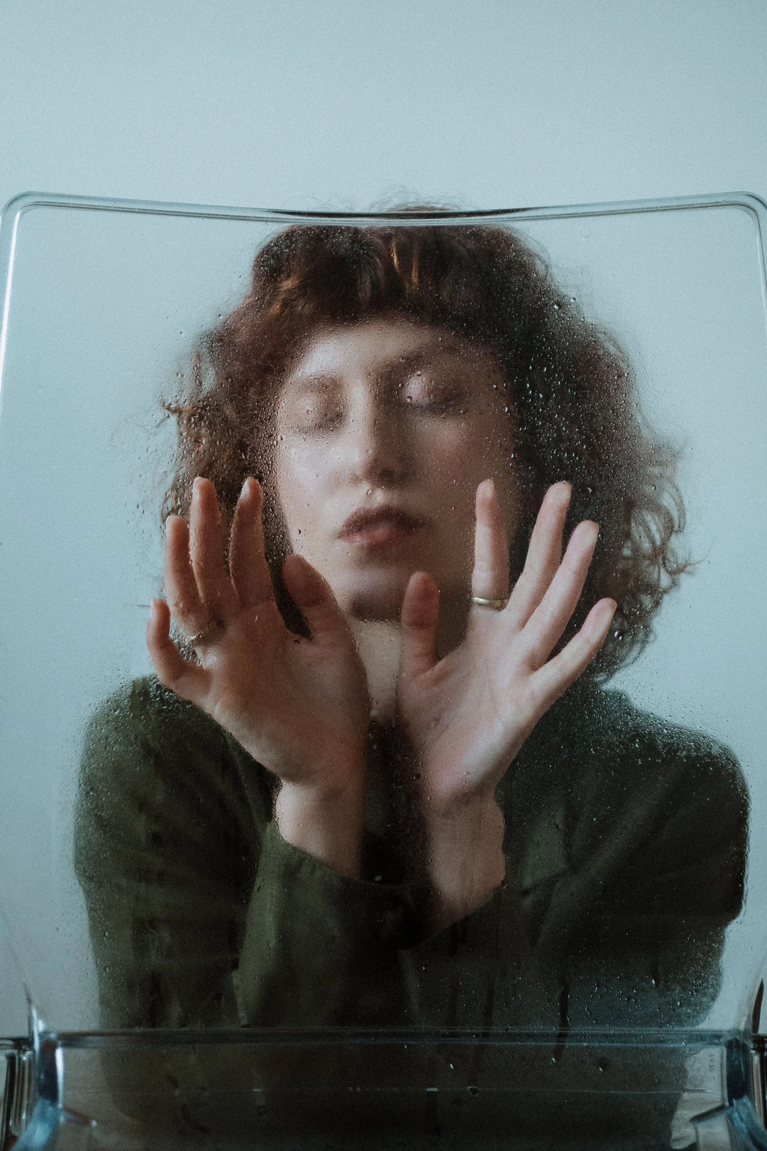 Artistic female portrait captured in motion, exploring fluidity, emotion, and creative expression.