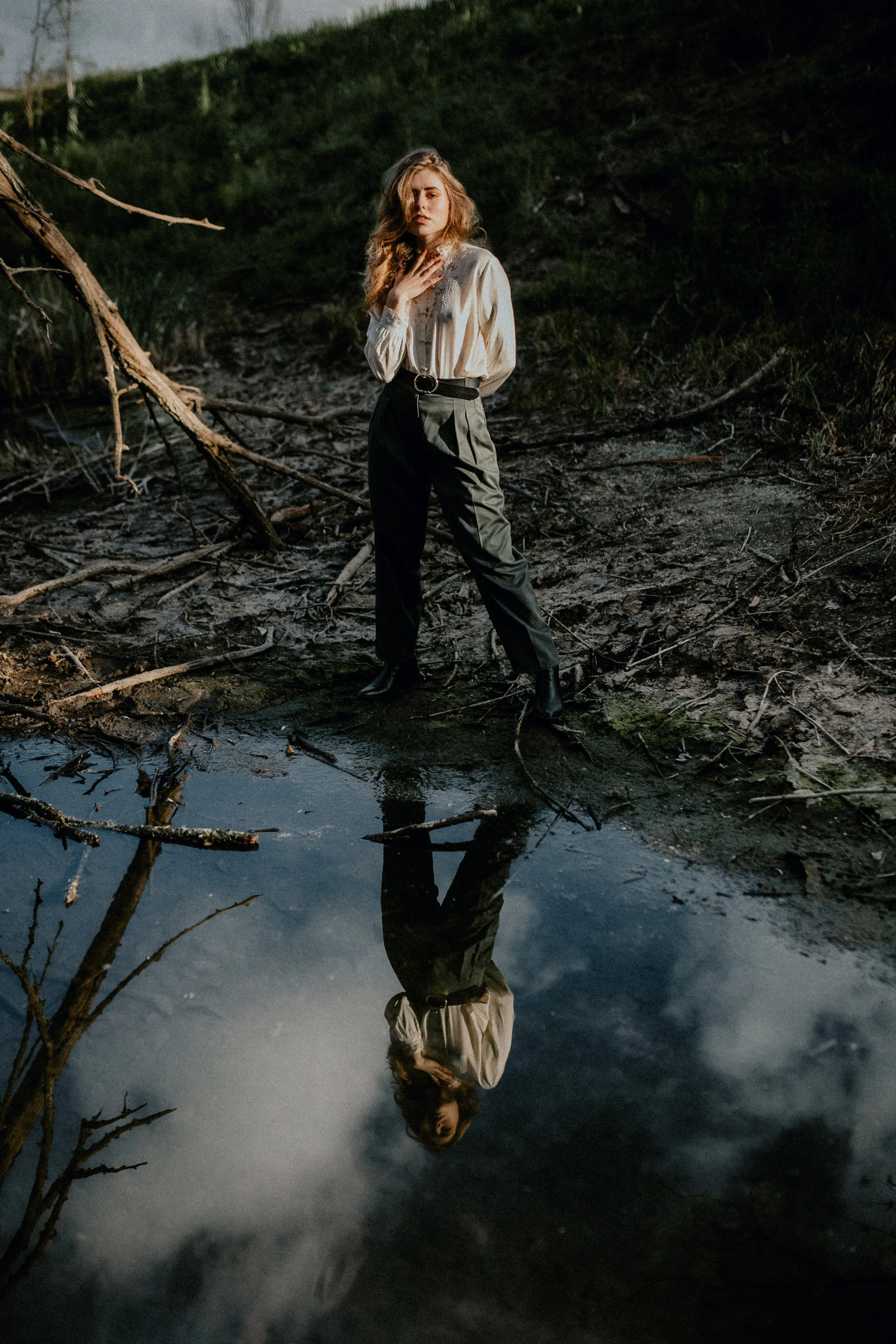 Model posing in nature lake