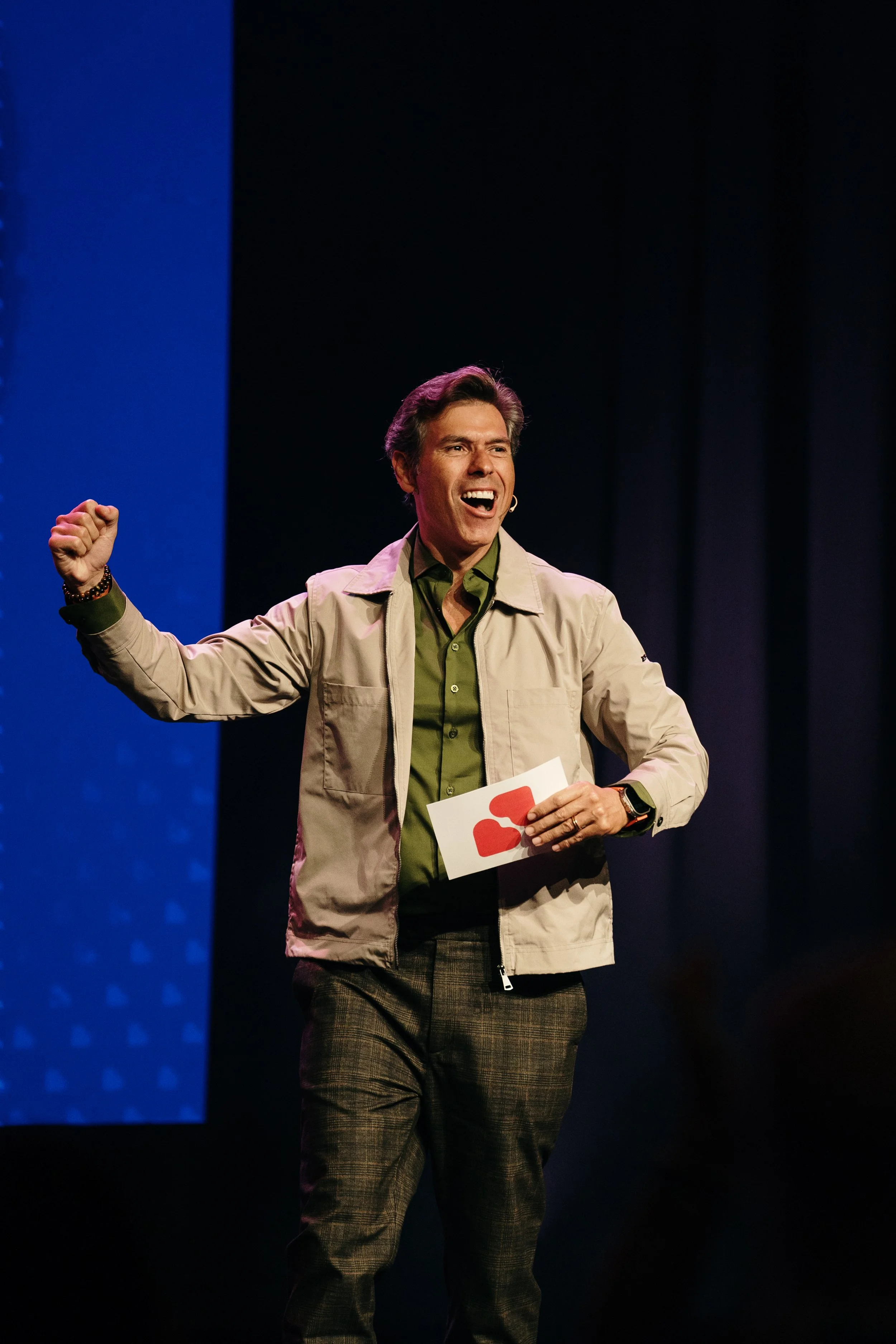 Corporate event photography capturing a speaker on stage during a professional conference in Lisbon.