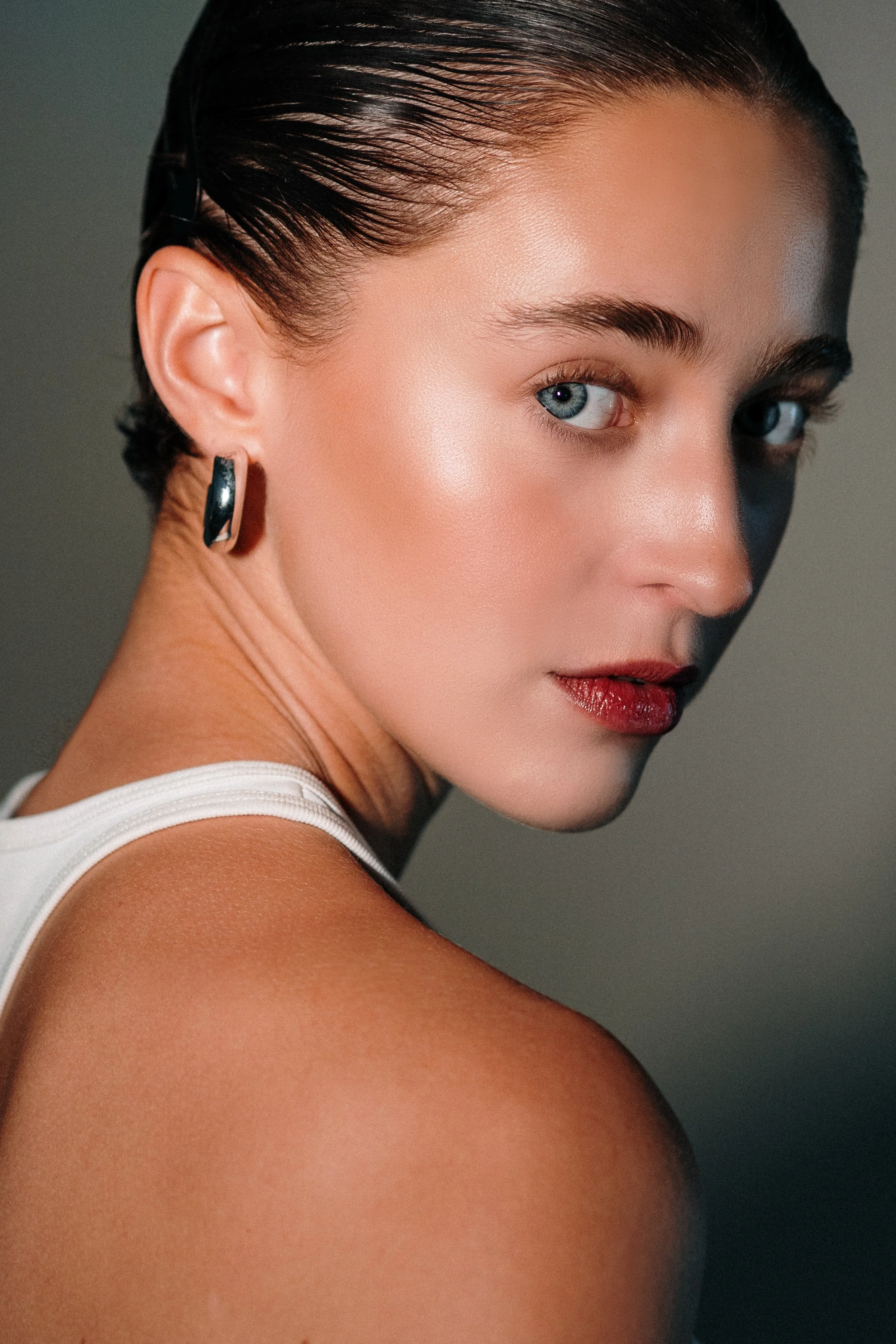 Editorial fashion portrait using colored lighting to create a bold, expressive, and contemporary mood.