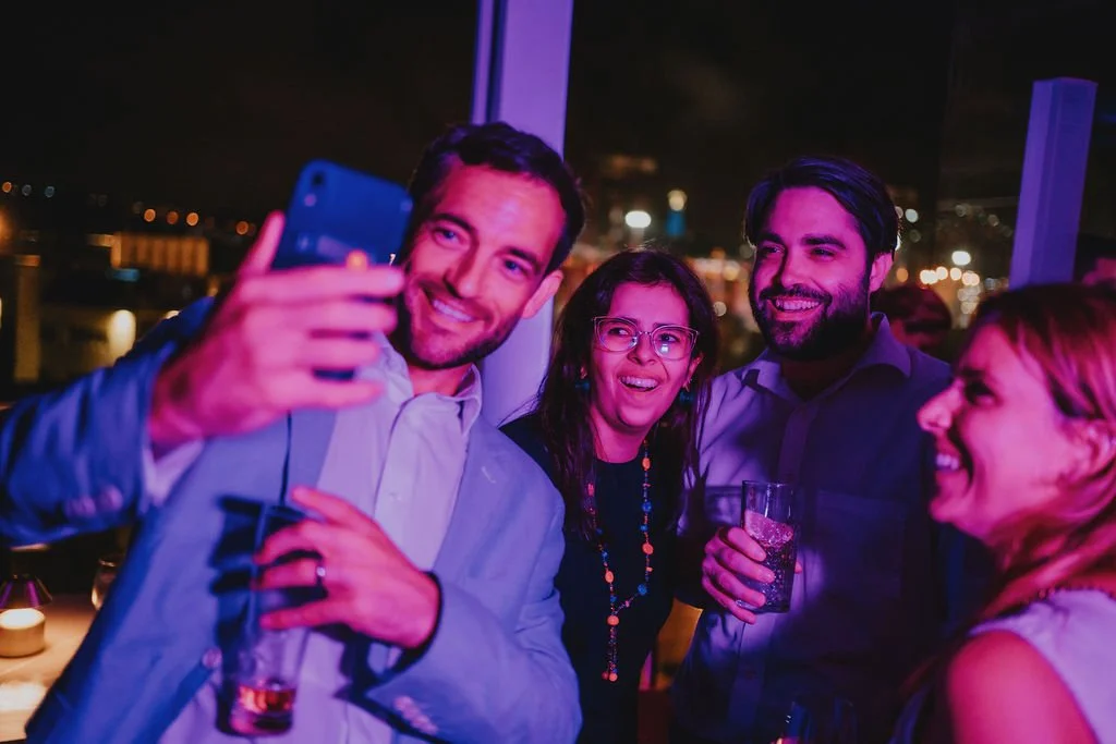 People taking a selfie at a party