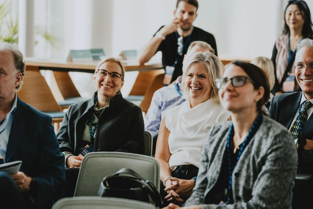 People smiling at a workshop
