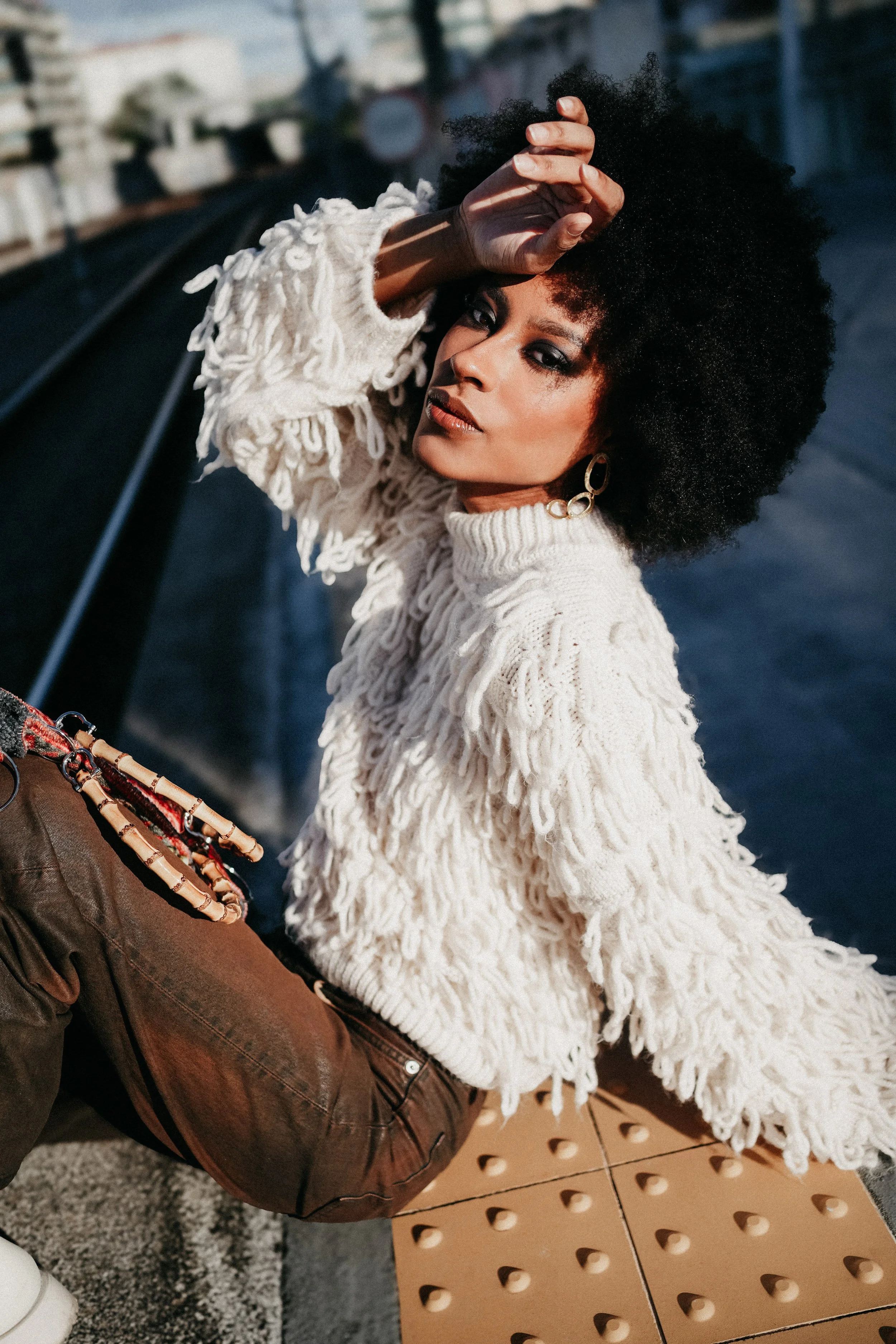 Sunny fashion editorial in train station