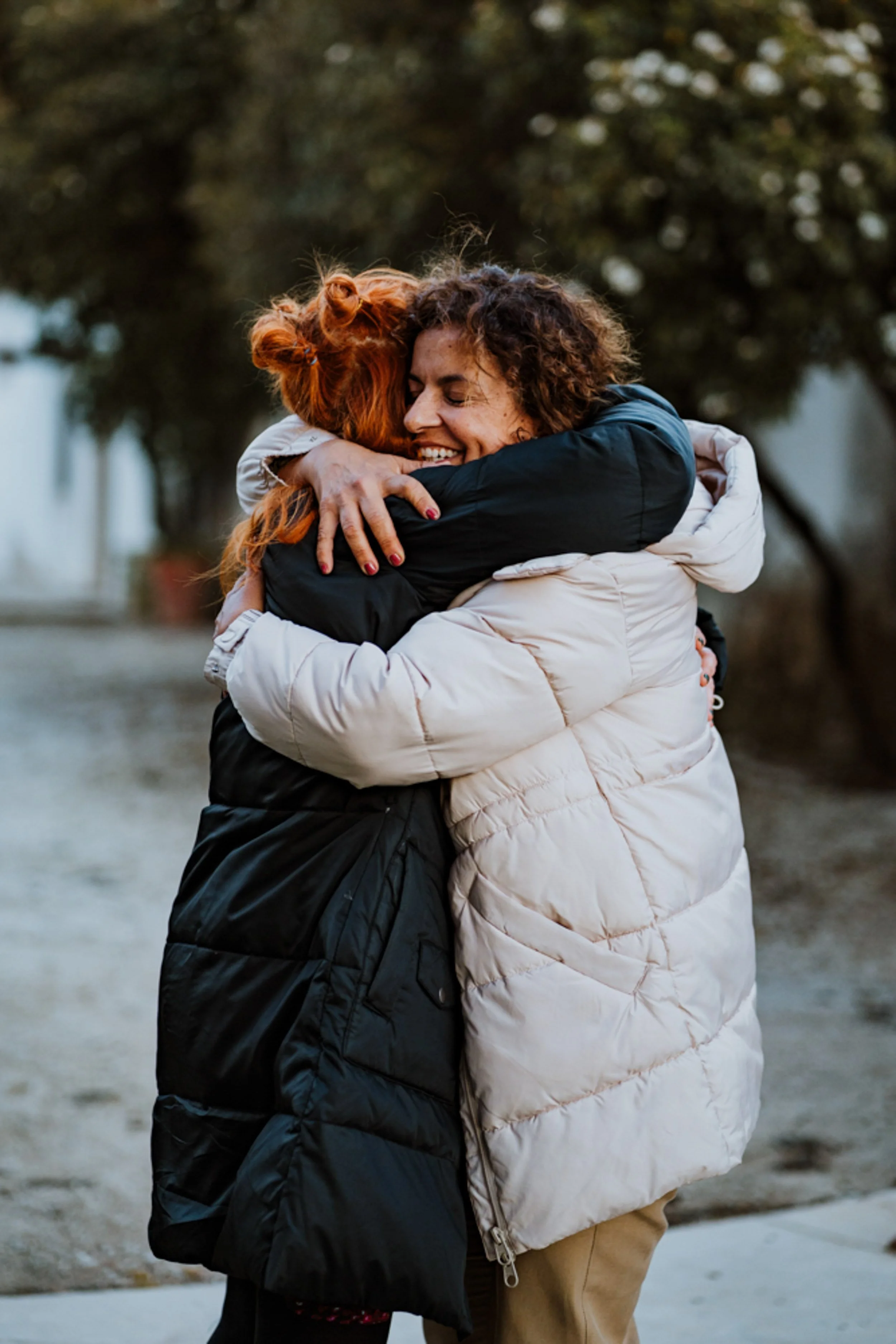 People hugging in a spiritual healing event