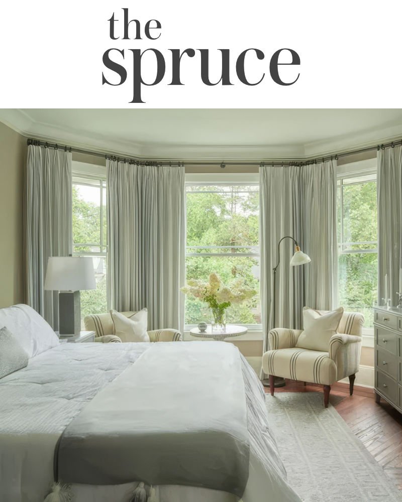 the spruce logo with a well-lit comfy bedroom
