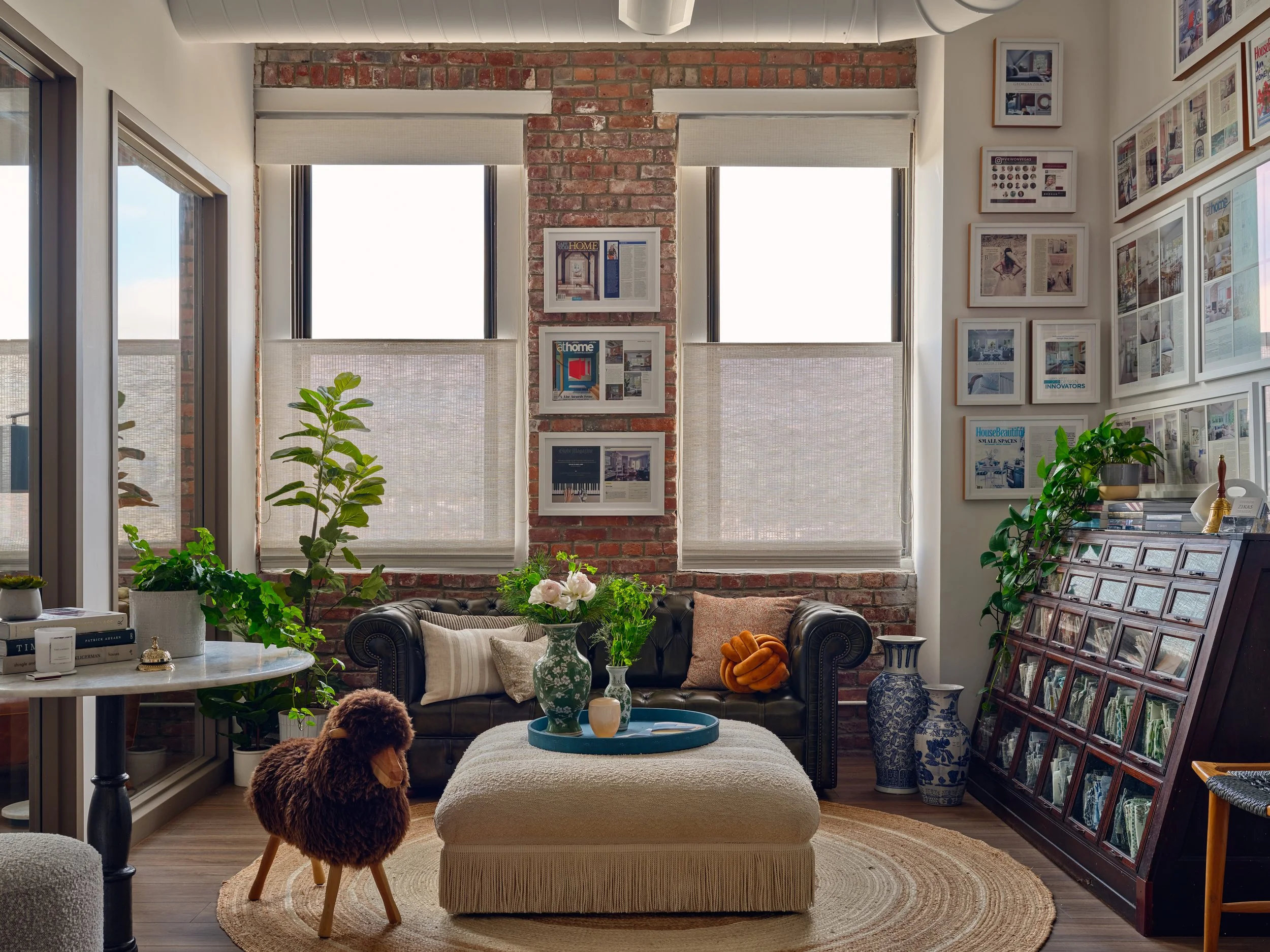 Interior of Georgia Zikas’ Boston design studio showcasing timeless furnishings and curated décor.