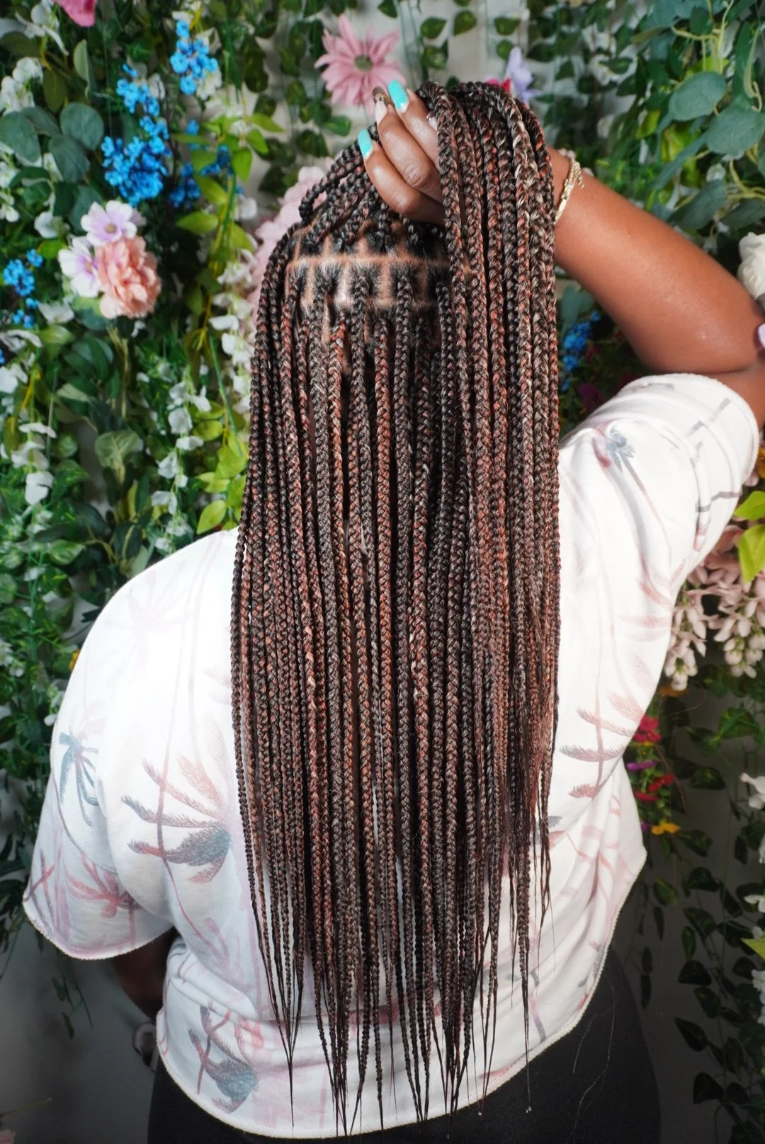 Brown girl wearing brown blend Navajo bronze braiding hair