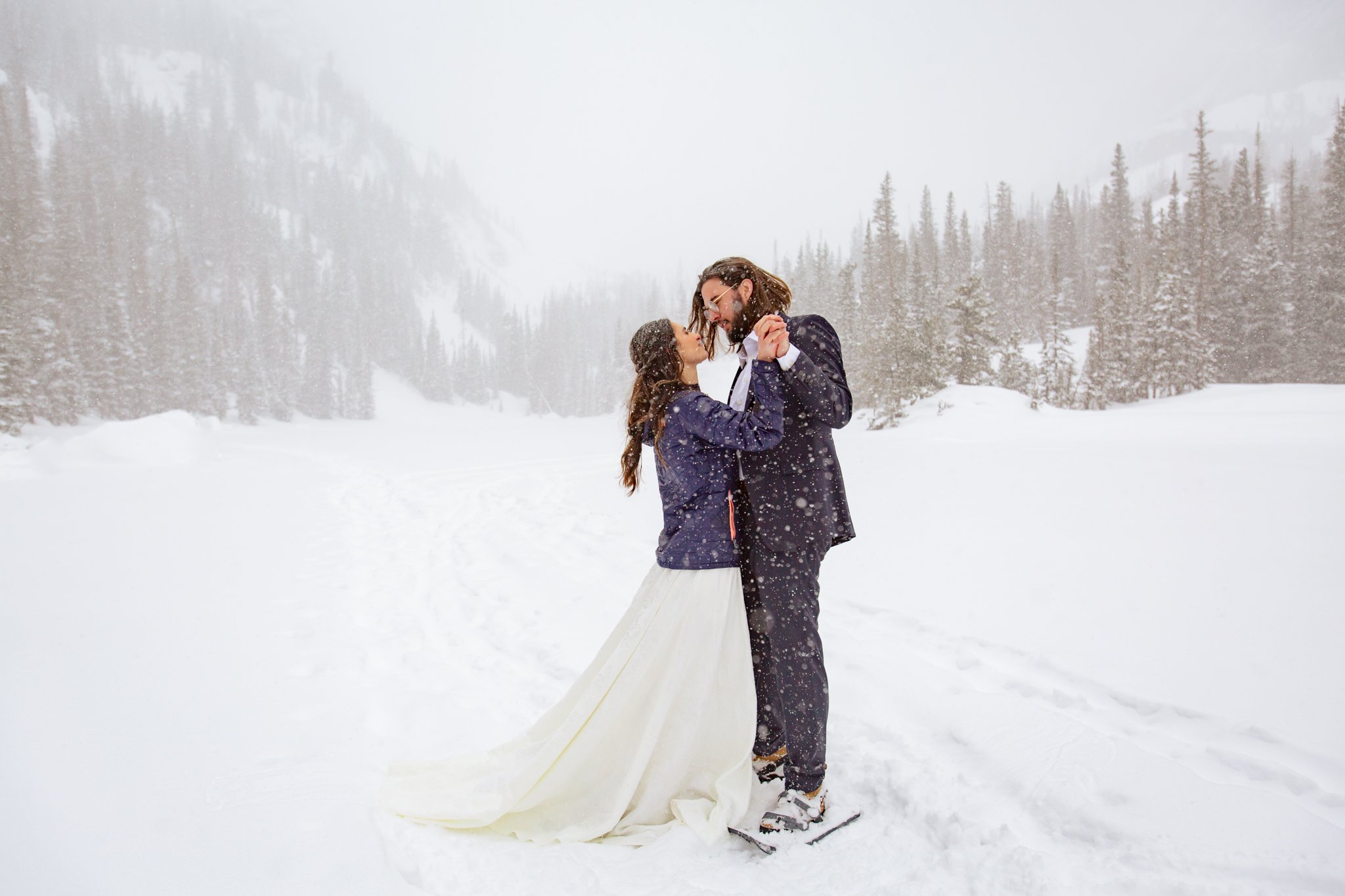  Couple dances on a frozen lake for their elopement in Rocky Mountain National Park 