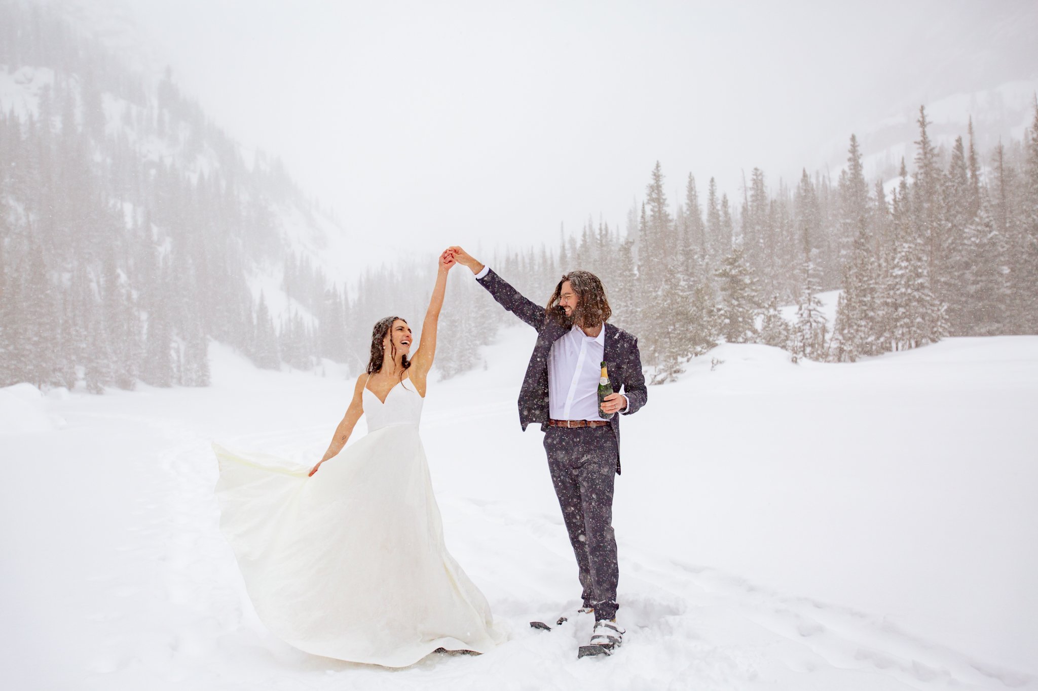  The groom spins his bride after eloping in Rocky Mountain National Park 