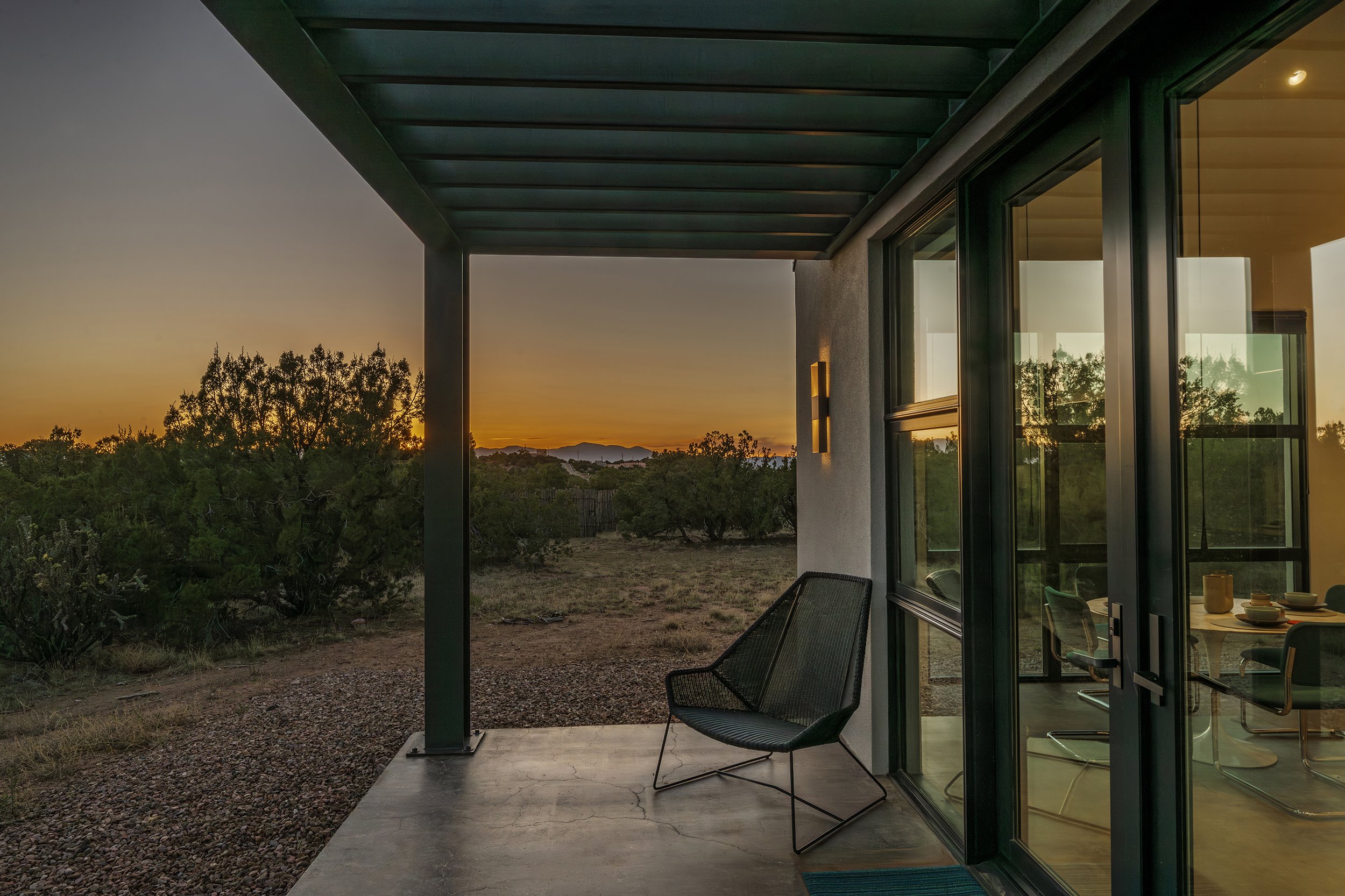 Contemporary outdoor guest space at sunset in Santa Fe
