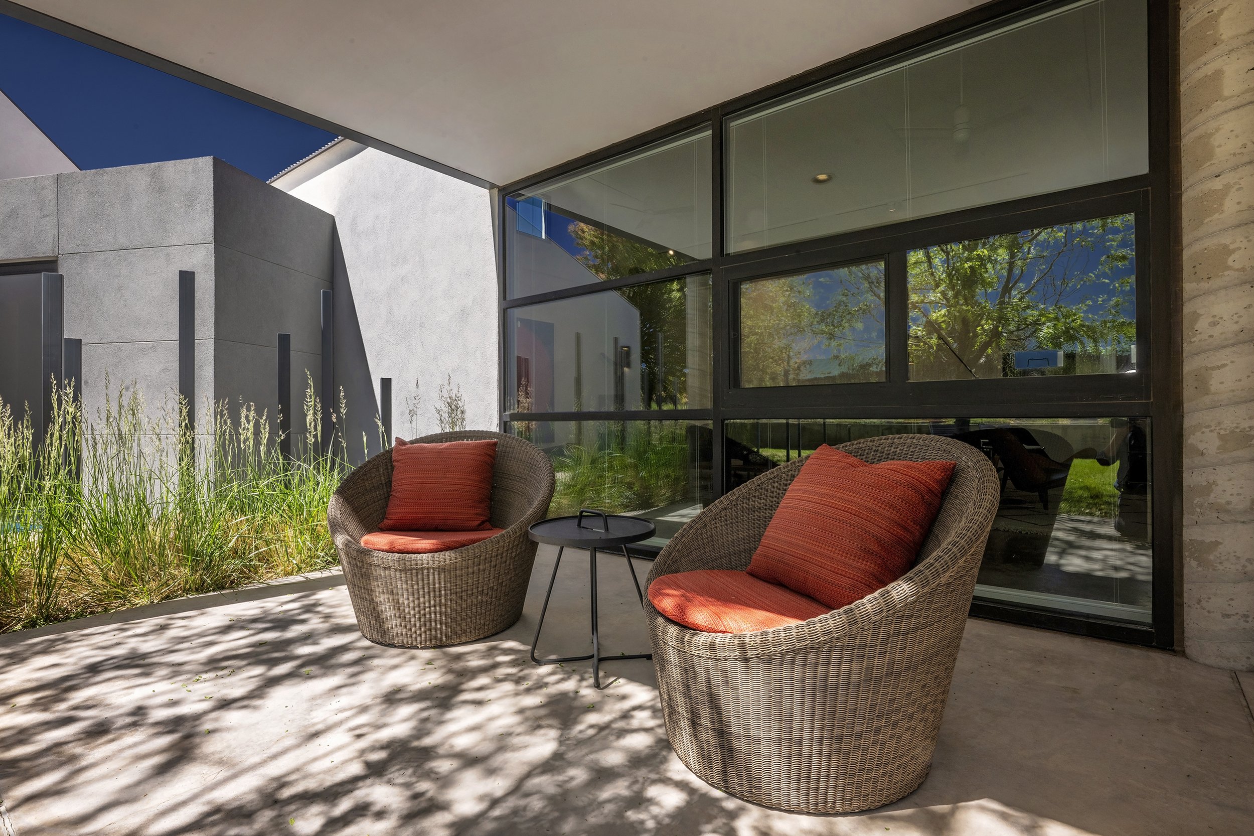 Cozy outdoor sitting space at contemporary house in Santa Fe