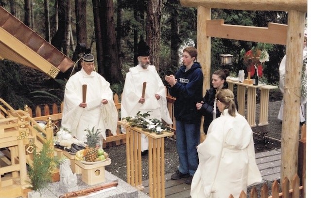 Kinomori Jinja at Bright Woods Spiritual Centre on Salt Spring Island. Ceremony participants offering sacred tamagushi branch.