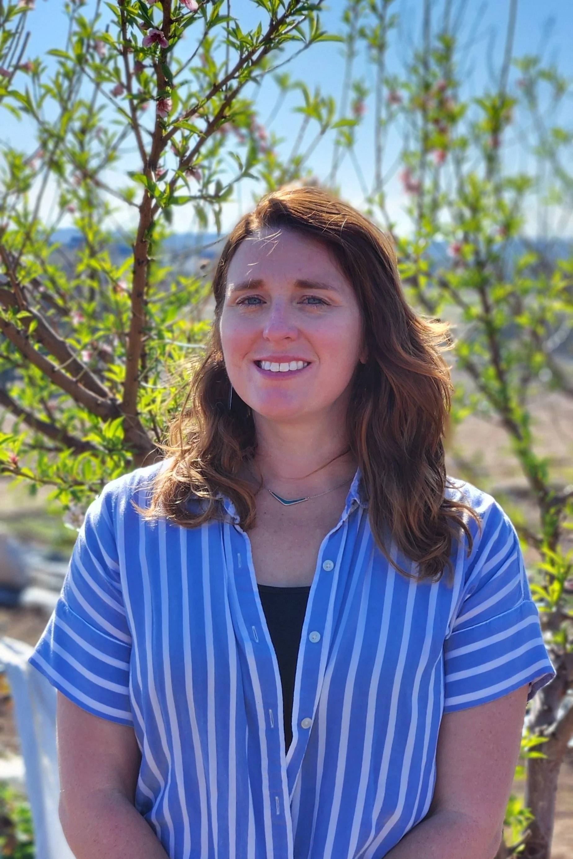 Woman smiling in a garden