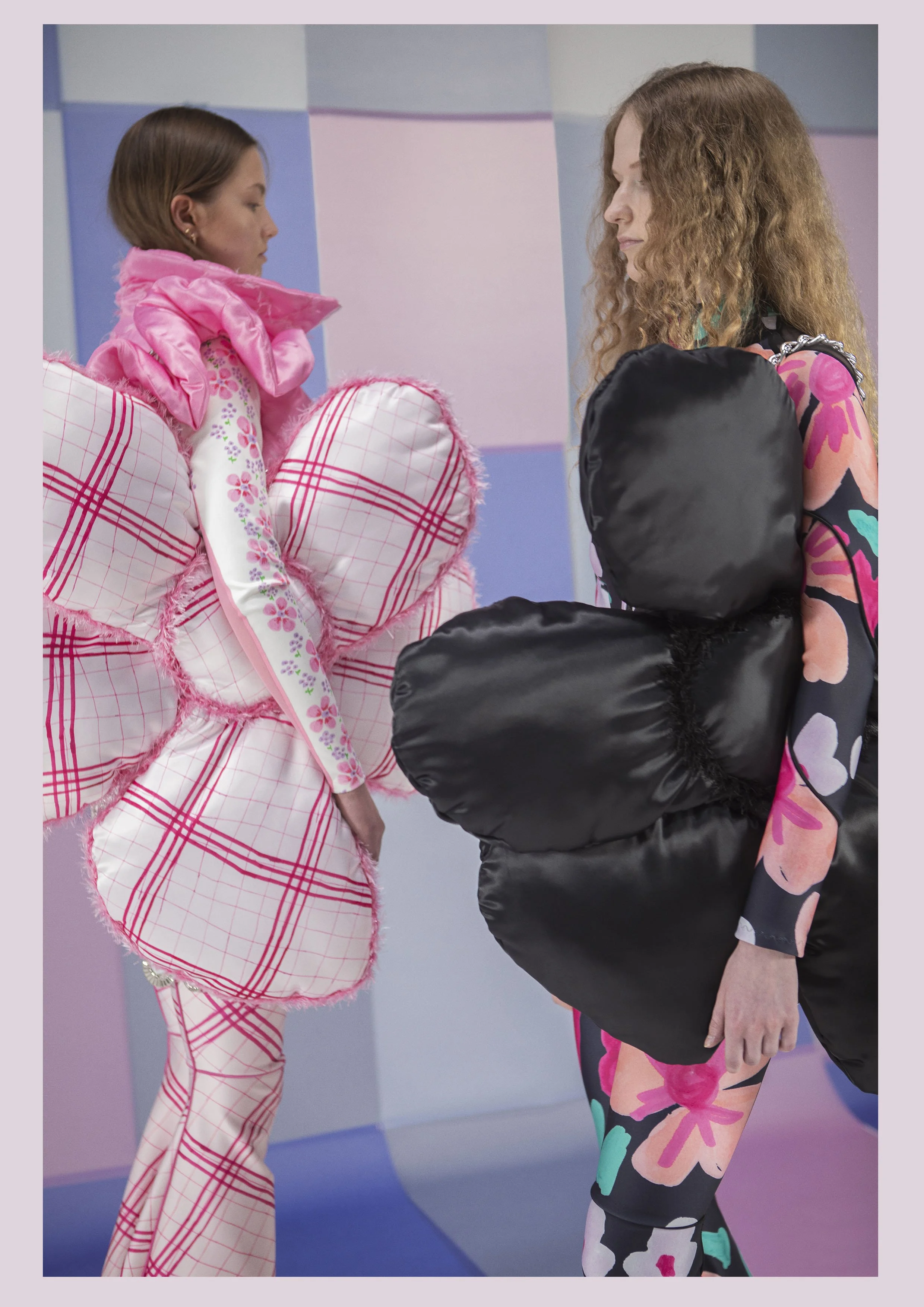 Model wearing gigantic flower and Tight fitting body and skipants made from scuba fabric with big flower print by Tuuli-Tytti Koivula