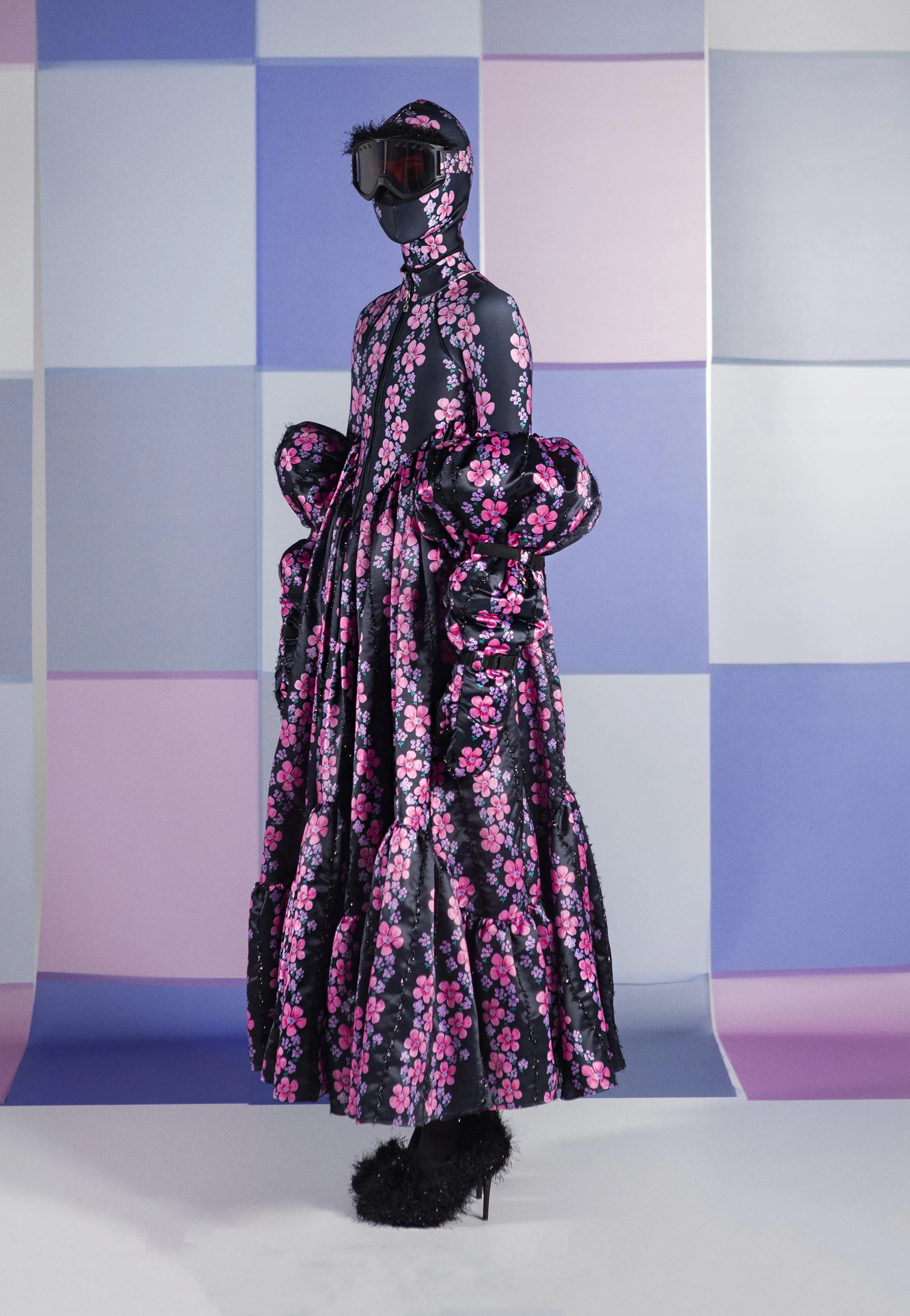 model wearing long embroidered dress with flower print