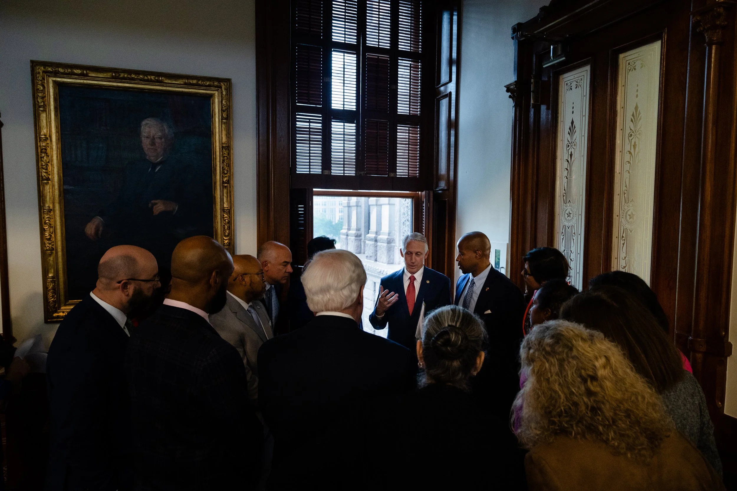  Democrats gathered to speak with state Rep. Gary Van Deaver, R-New Boston, to try to convince him to remove a particular amendment from an anti-DEI bill on the House floor of the state Capitol in Austin on April 6, 2023. Ultimately no compromise was