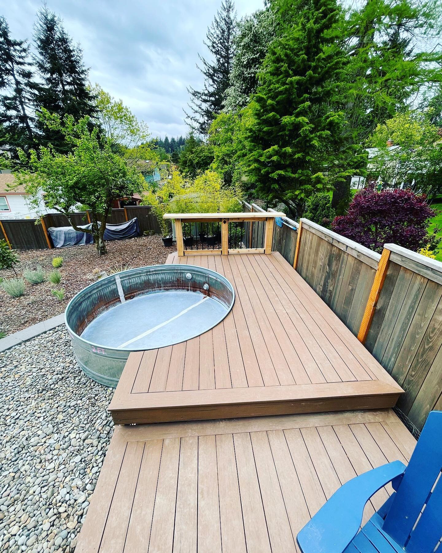 These happy clients are ready to #beattheheat  this summer with their brand new #stocktankpool deck! Featuring @timbertech terrain brown oak from @parrlumberco and a custom #cedar #bartop.