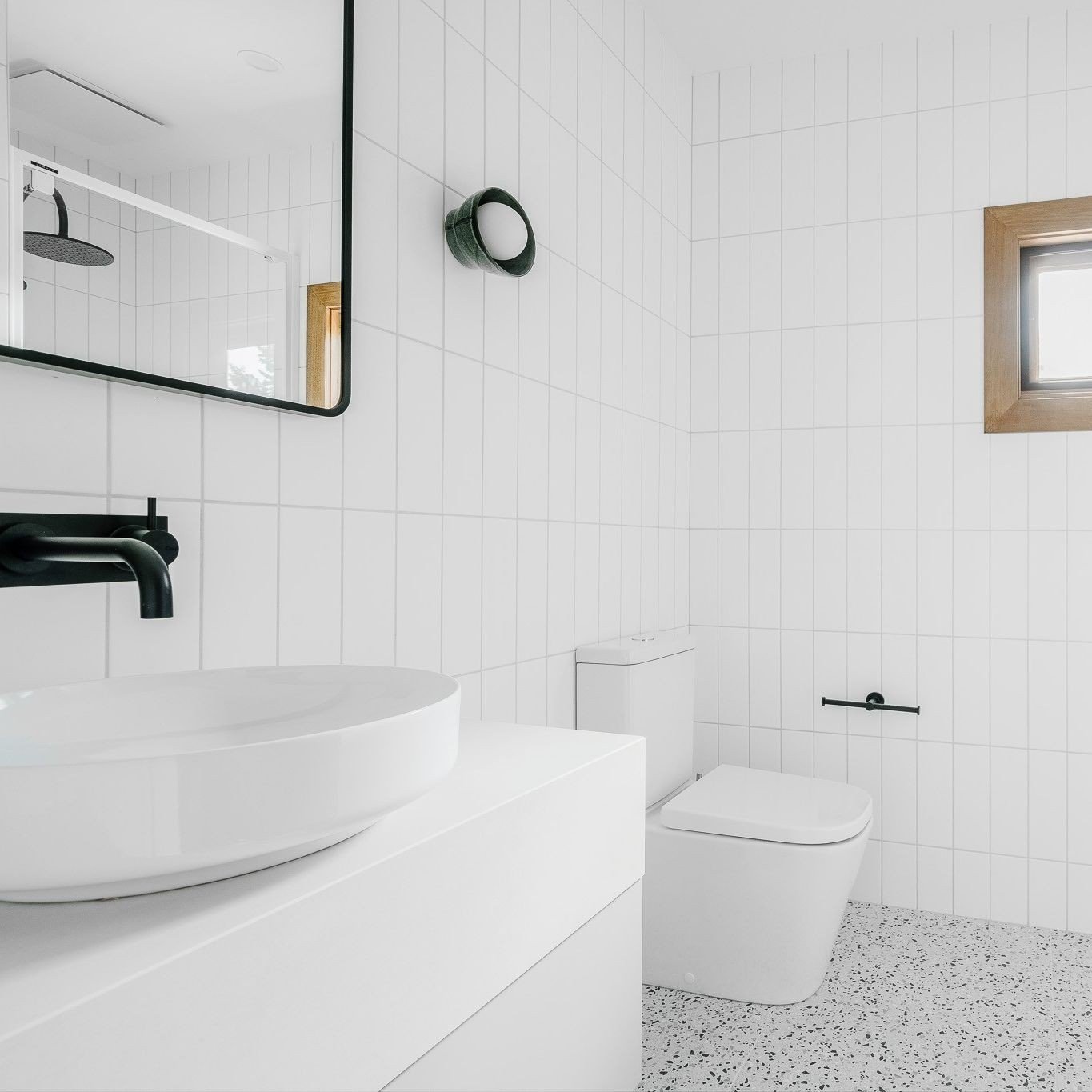 Before, during and after - the upstairs bathroom at The Residence was previously a 70s stunner. The transformation involved splitting the previous large and wasted space into two bathrooms, refreshing the materials with simple white wall tiles, and a