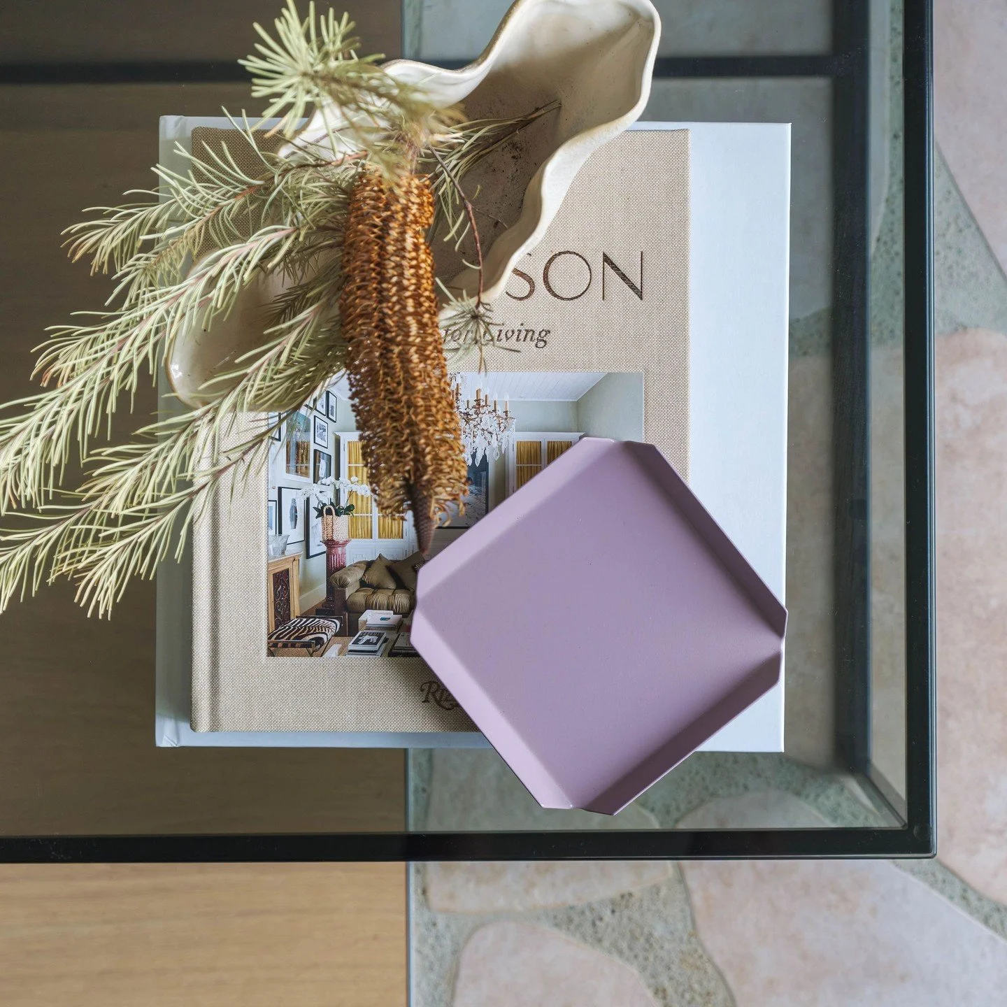 Steal this exact combination of five things to make your coffee tables stand out:⁠
1. Something green and organic in shape⁠
2. A sculptural item with movement and character (the wavy vase)⁠
4. A tray or coasters⁠
5. A stack of books⁠
6. A textured, p