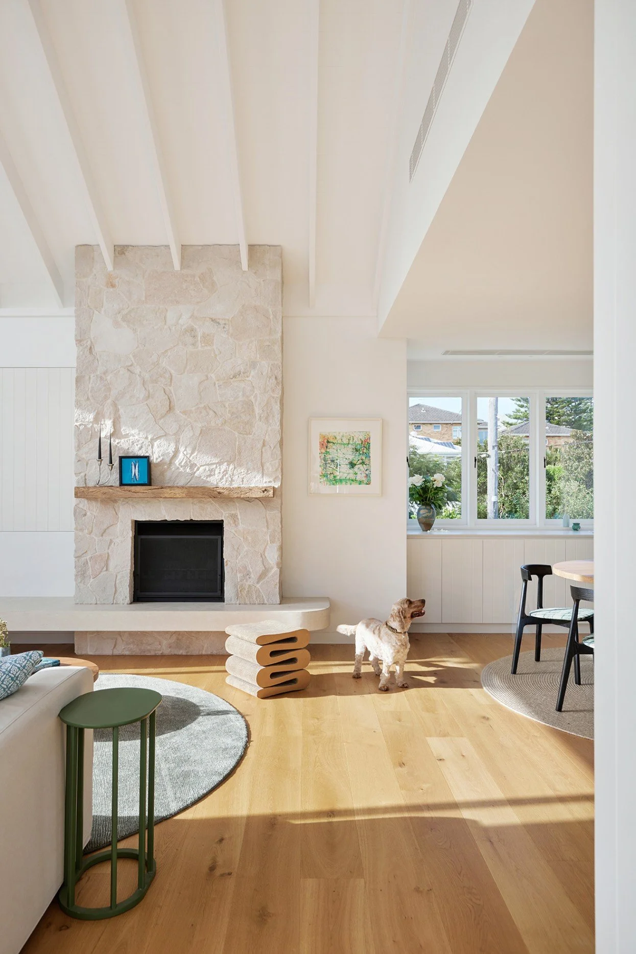 Sandstone clad open fireplace in the living room of High Tide
