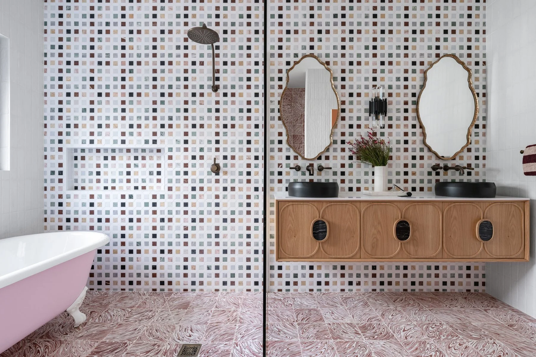 The main bathroom features a wet zone and a dry zone, unified via the materials palette.