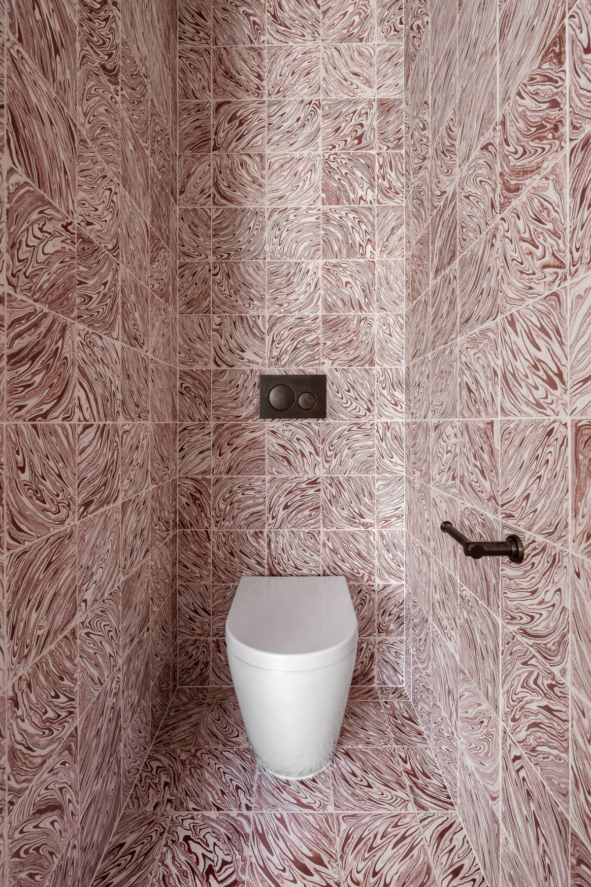 The WC is a truly immersive experience with the Tradewinds Terracotta floor tiles extended up all walls to the ceiling.