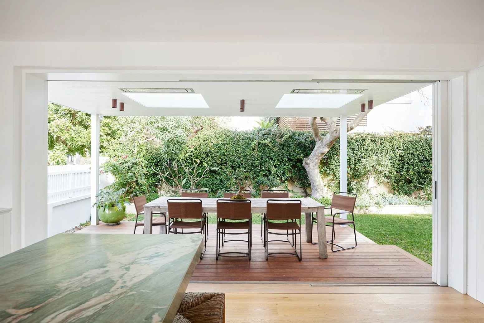 Rear entertaining deck at High Tide features furniture from Eco Outdoor