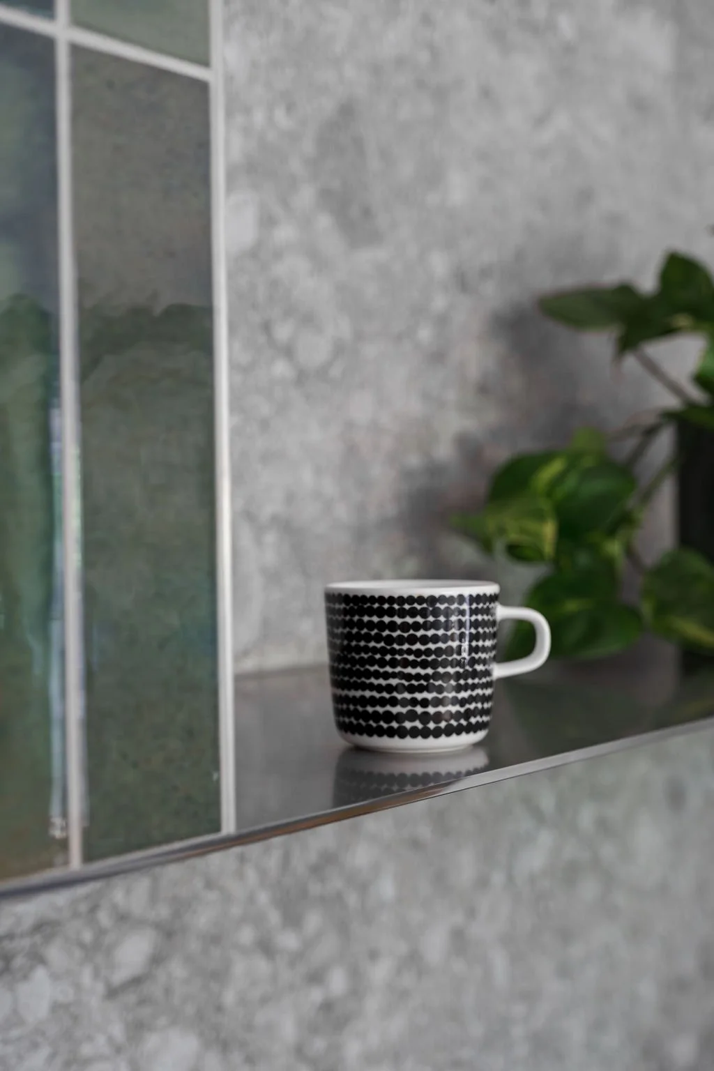 The kitchen exhaust has been extended into a multi-purpose shelf.