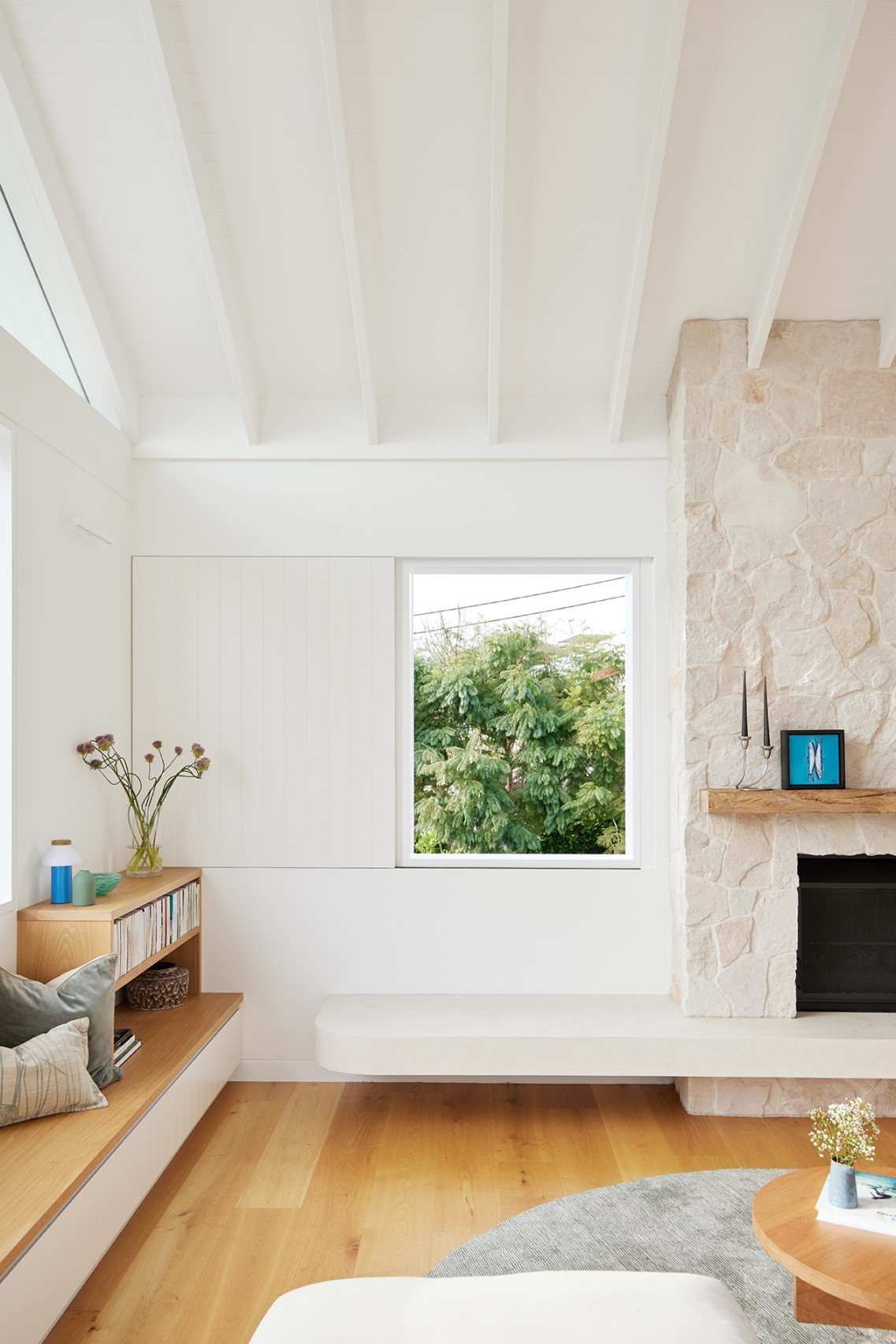 The living room presents as a formal space at High Tide, with the TV hidden