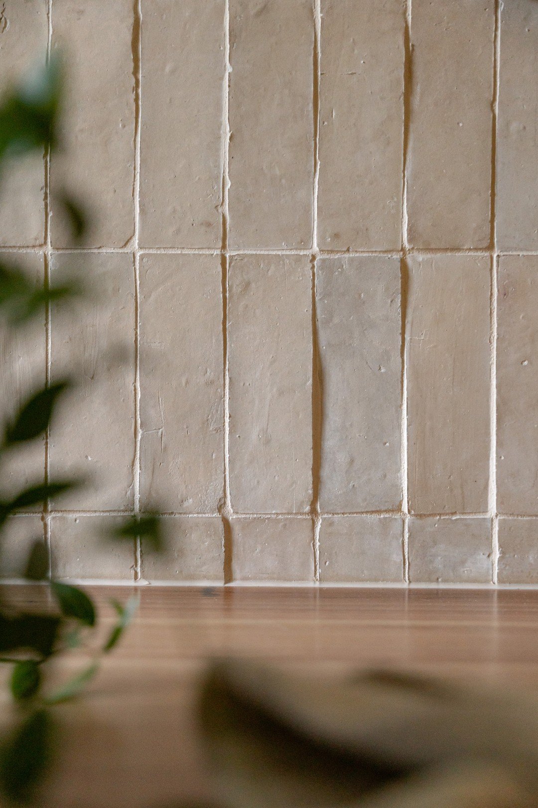 Main bathroom detail of the blackbutt timber vanity top and thin clay Bejmat tiles.