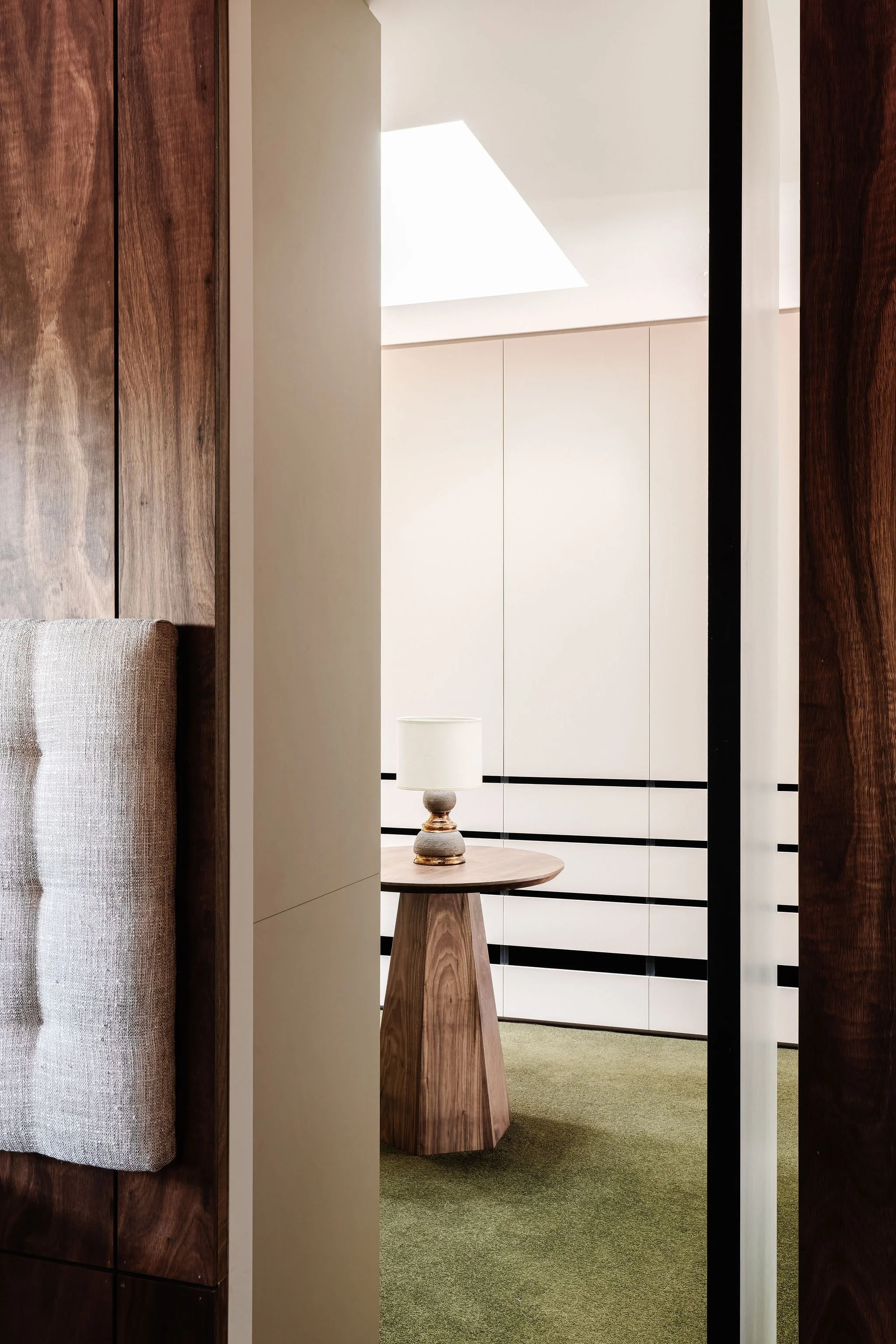 The Main Bedroom suite featuring a faceted wardrobe table designed by Britt White Studio, crafted by Steel Road