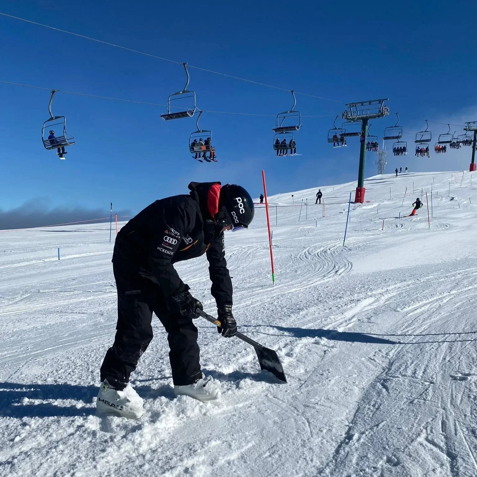 Matt White coach at Team Hotham prepares a slalom track
