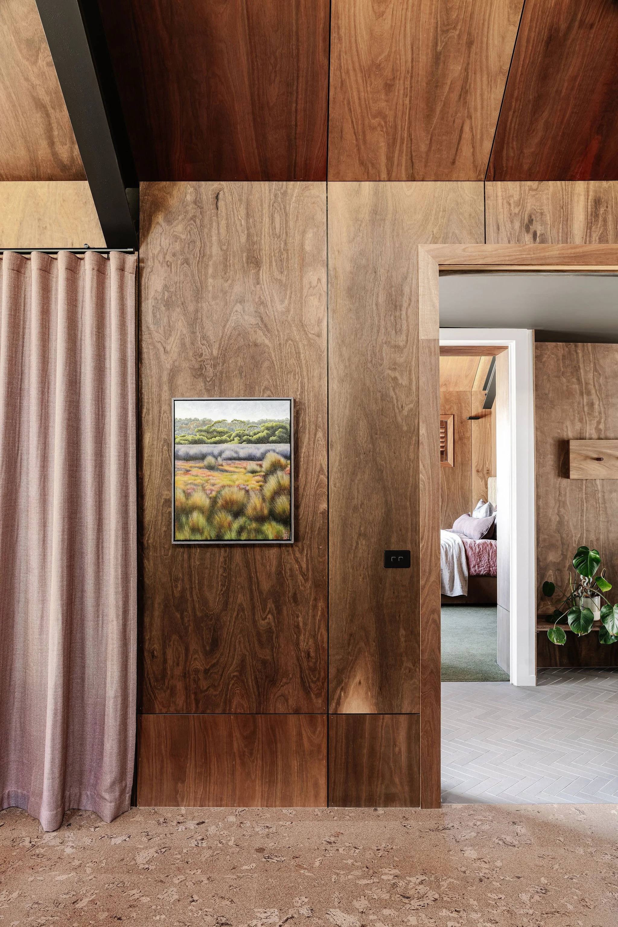 Passing through the entrance passageway, and adjoining Mud Room, the Main Bedroom Suite also occupies the upper level of Alpine Glow