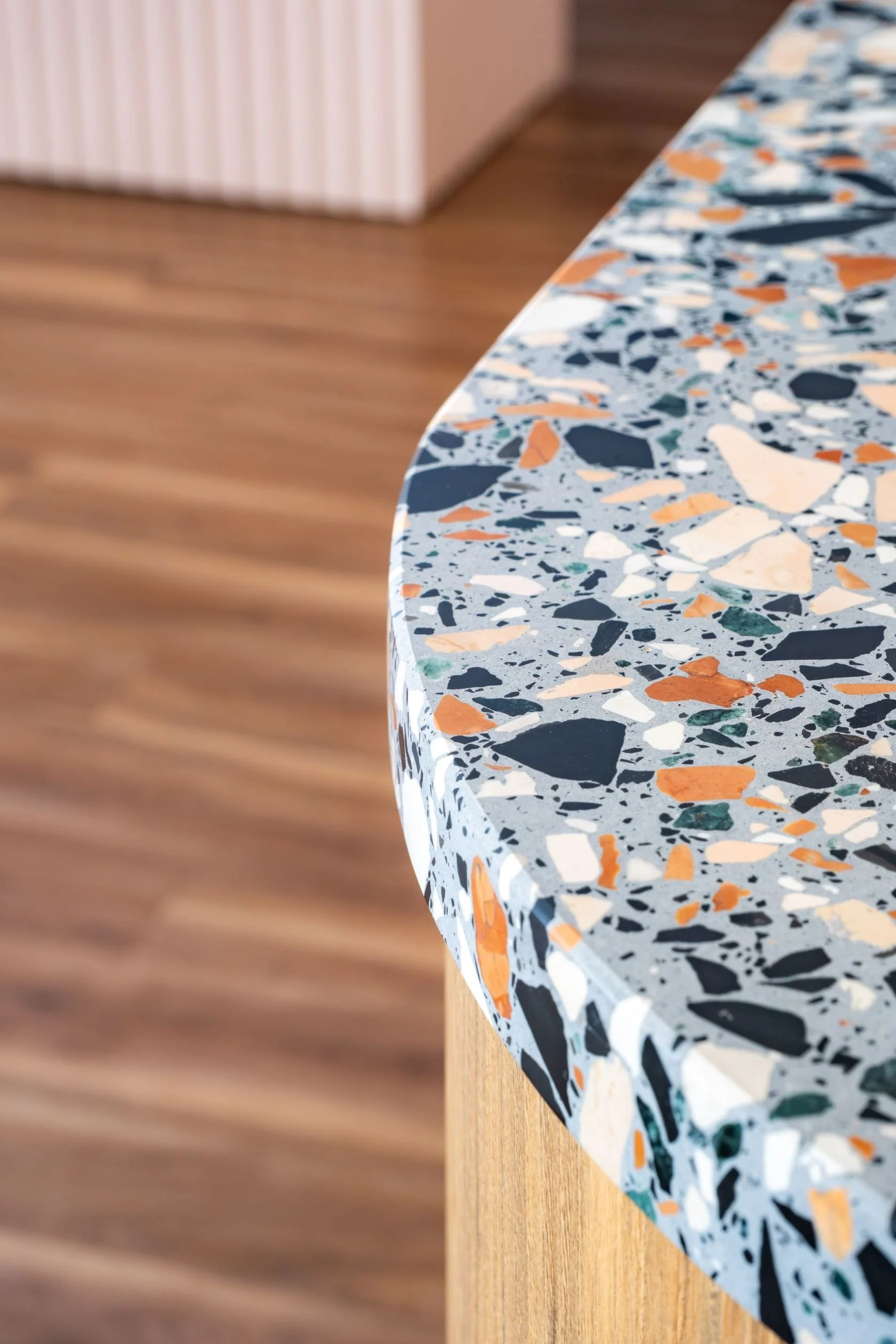 The repeated terrazzo becomes the project's visual signature: playful, refined, tactile and very personal.