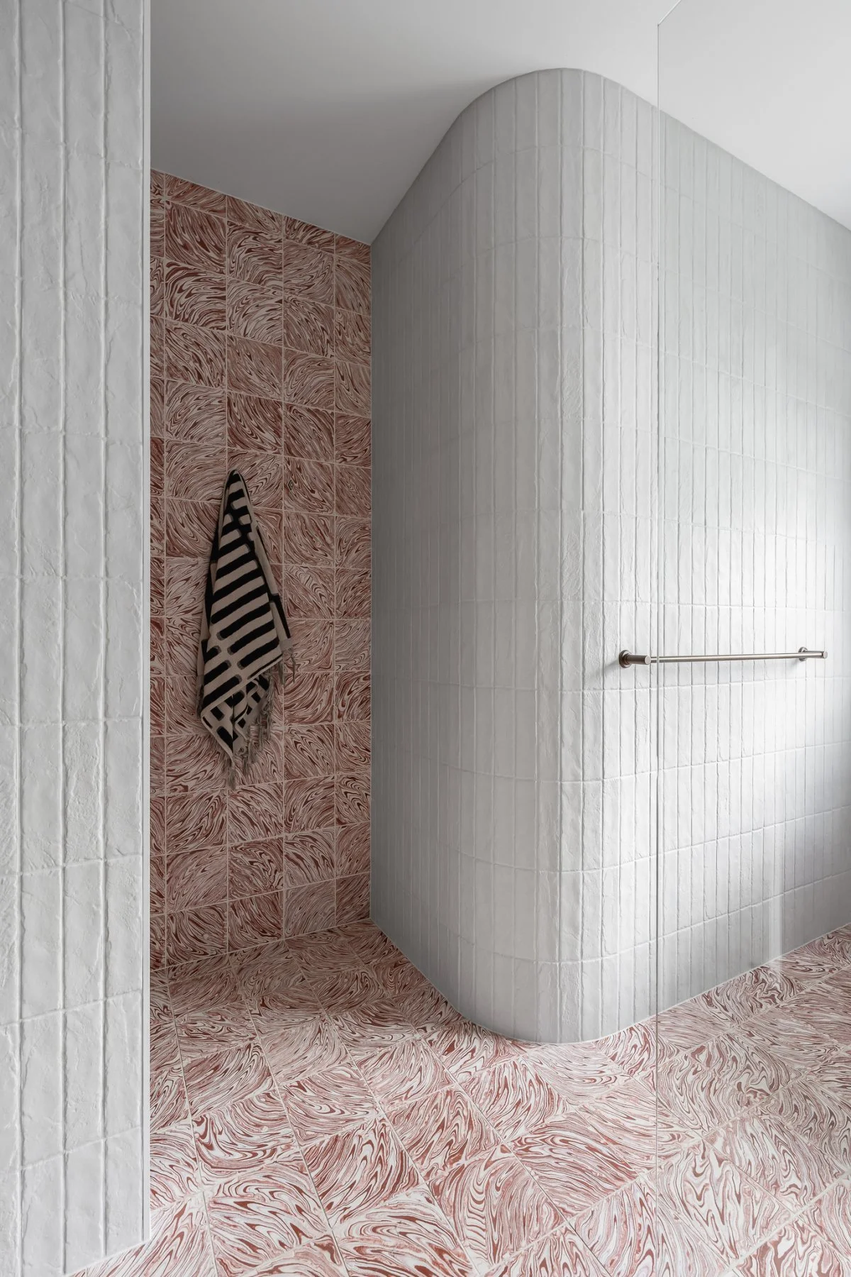 The playful exchange between Tradewinds Terracotta floor and wall tiles by Sibella Court, is a defining feature of the main bathroom and WC.