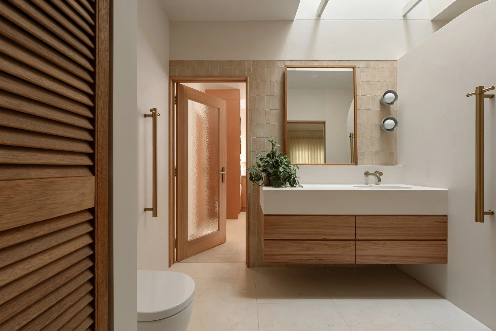 The Ensuite of the Doughty House features a consistent design langues to that of the main bathroom.