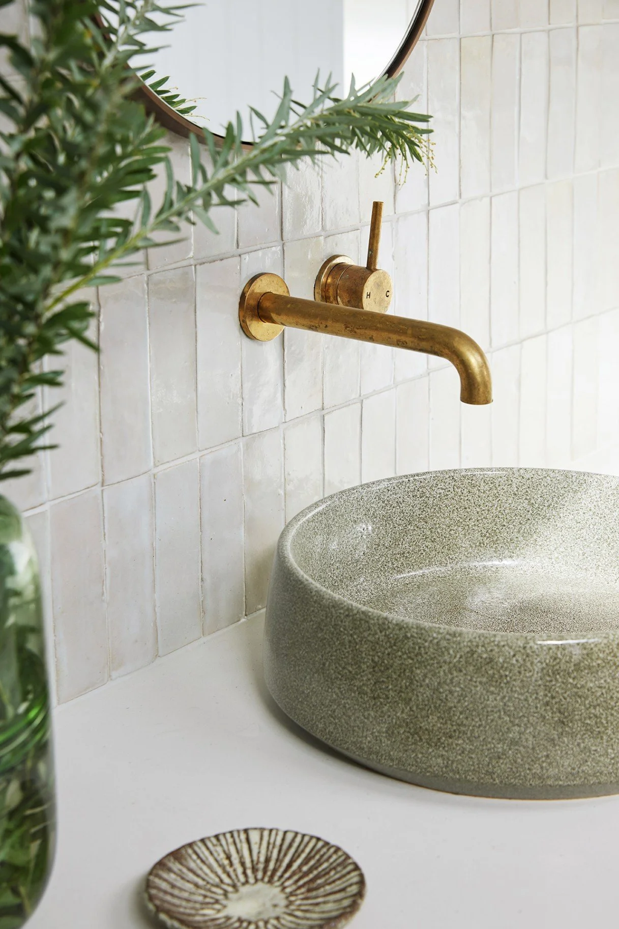Ensuite details, including benchtop, sink, tapware and mirror at High Tide