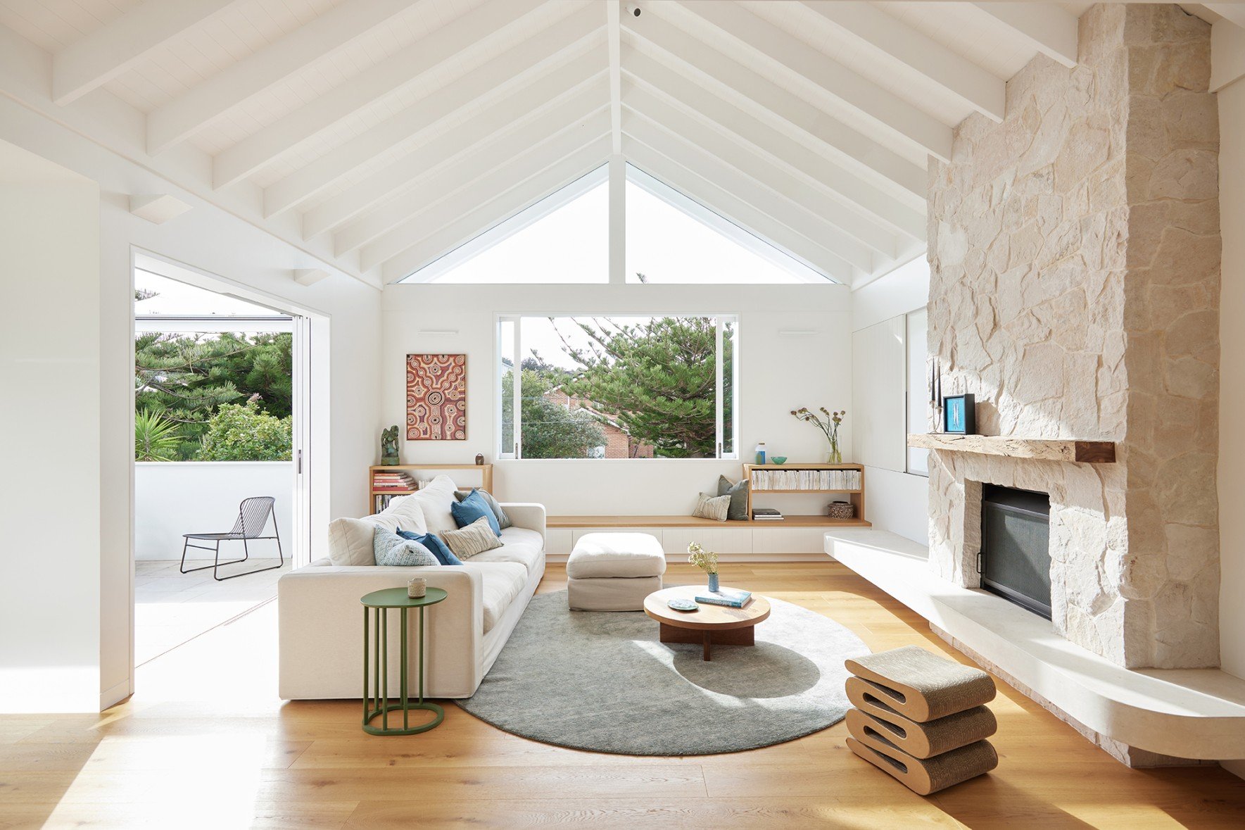 Light filled living room extending on to the front deck at High Tide Freshwater